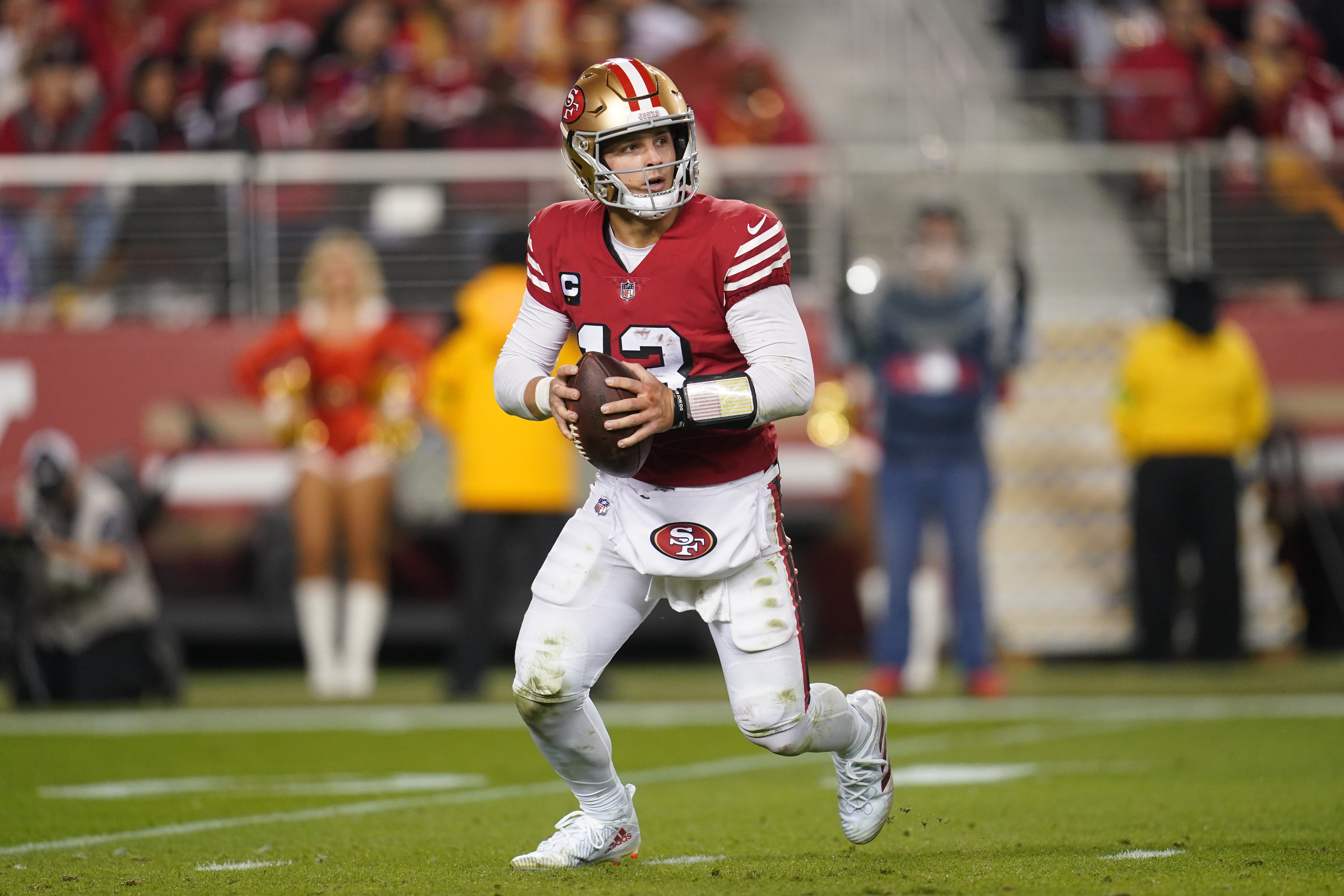 Dec 25, 2023; Santa Clara, California, USA; San Francisco 49ers quarterback Brock Purdy (13) runs the ball against the Baltimore Ravens in the fourth quarter at Levi's Stadium.