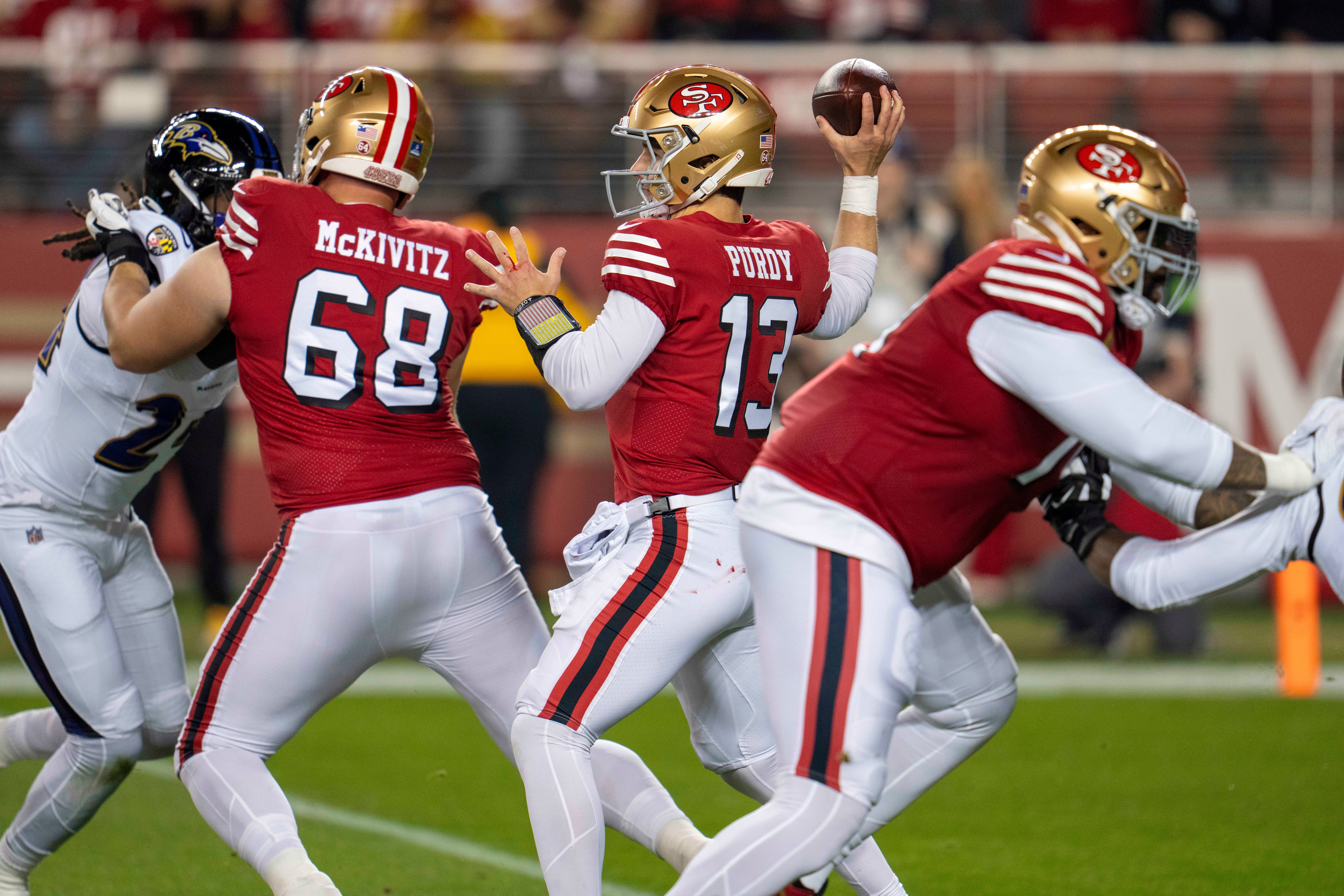 Dec 25, 2023; Santa Clara, California, USA; San Francisco 49ers quarterback Brock Purdy (13) prepares to pass the football against the Baltimore Ravens during the first quarter at Levi's Stadium.