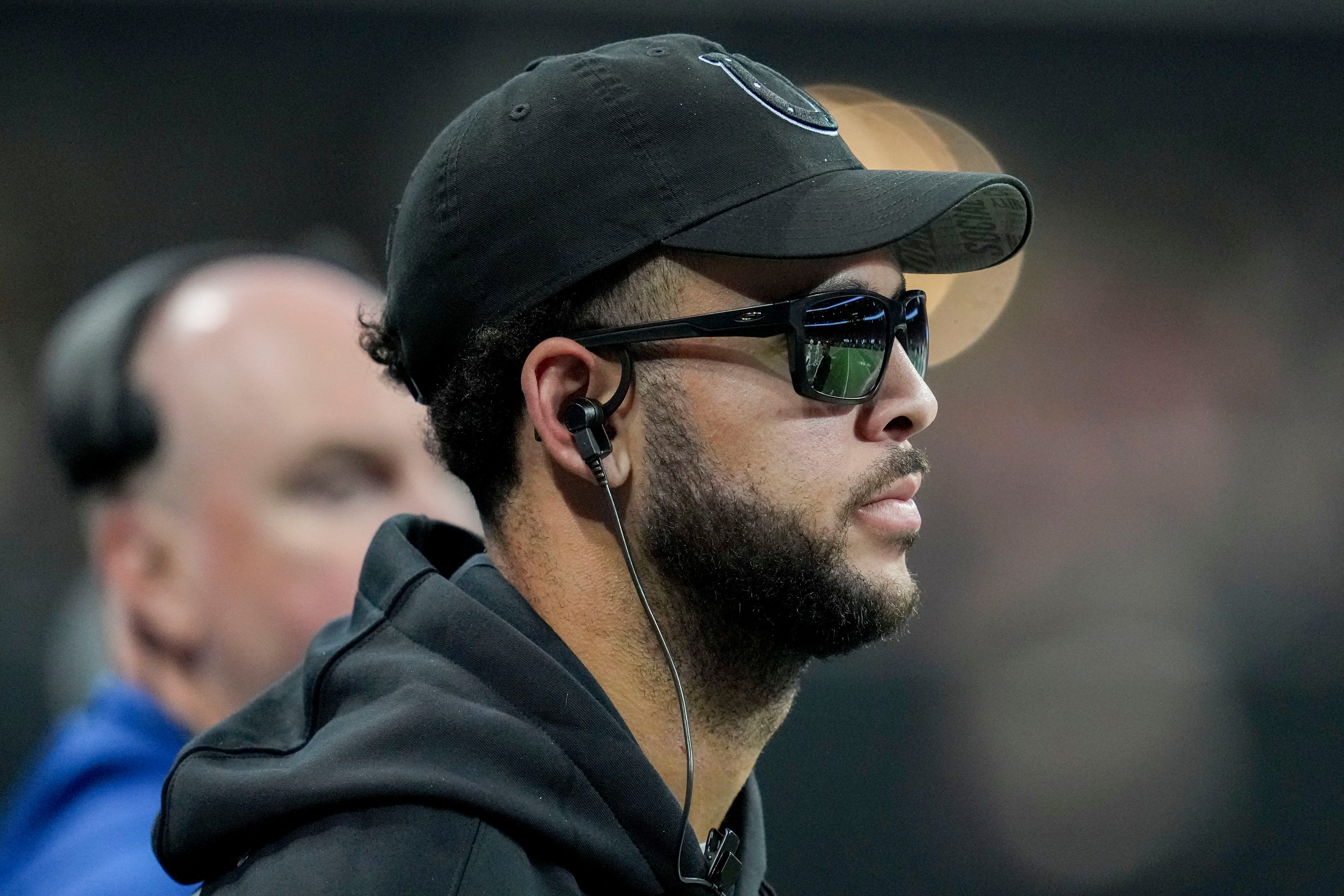 An injured Indianapolis Colts wide receiver Michael Pittman Jr. (11) watches the action from the sideline Sunday, Dec. 24, 2023, during a game against the Atlanta Falcons at Mercedes-Benz Stadium in Atlanta.