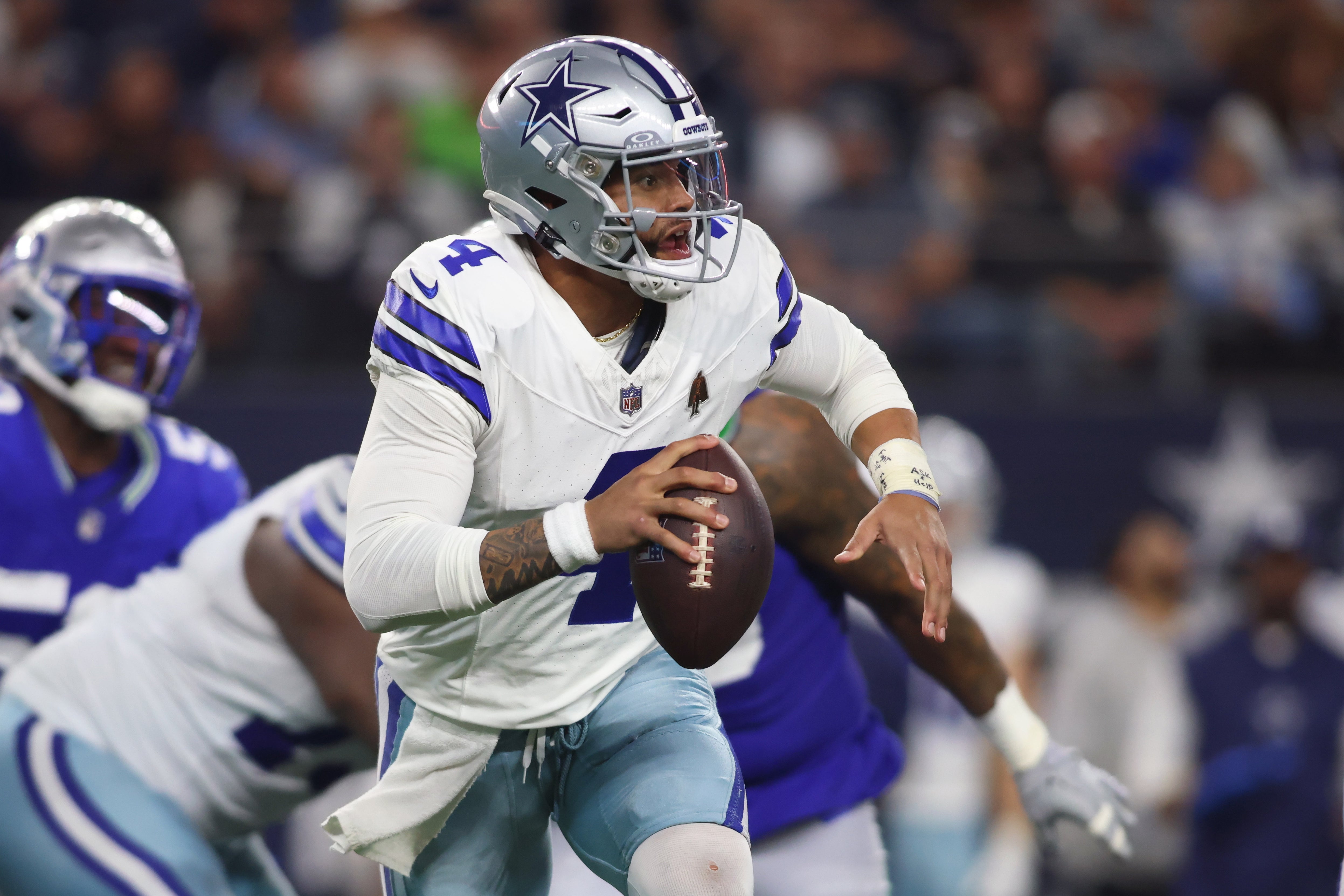 Dallas Cowboys quarterback Dak Prescott (4) looks to pass during the second half against the Seattle Seahawks at AT&T Stadium.