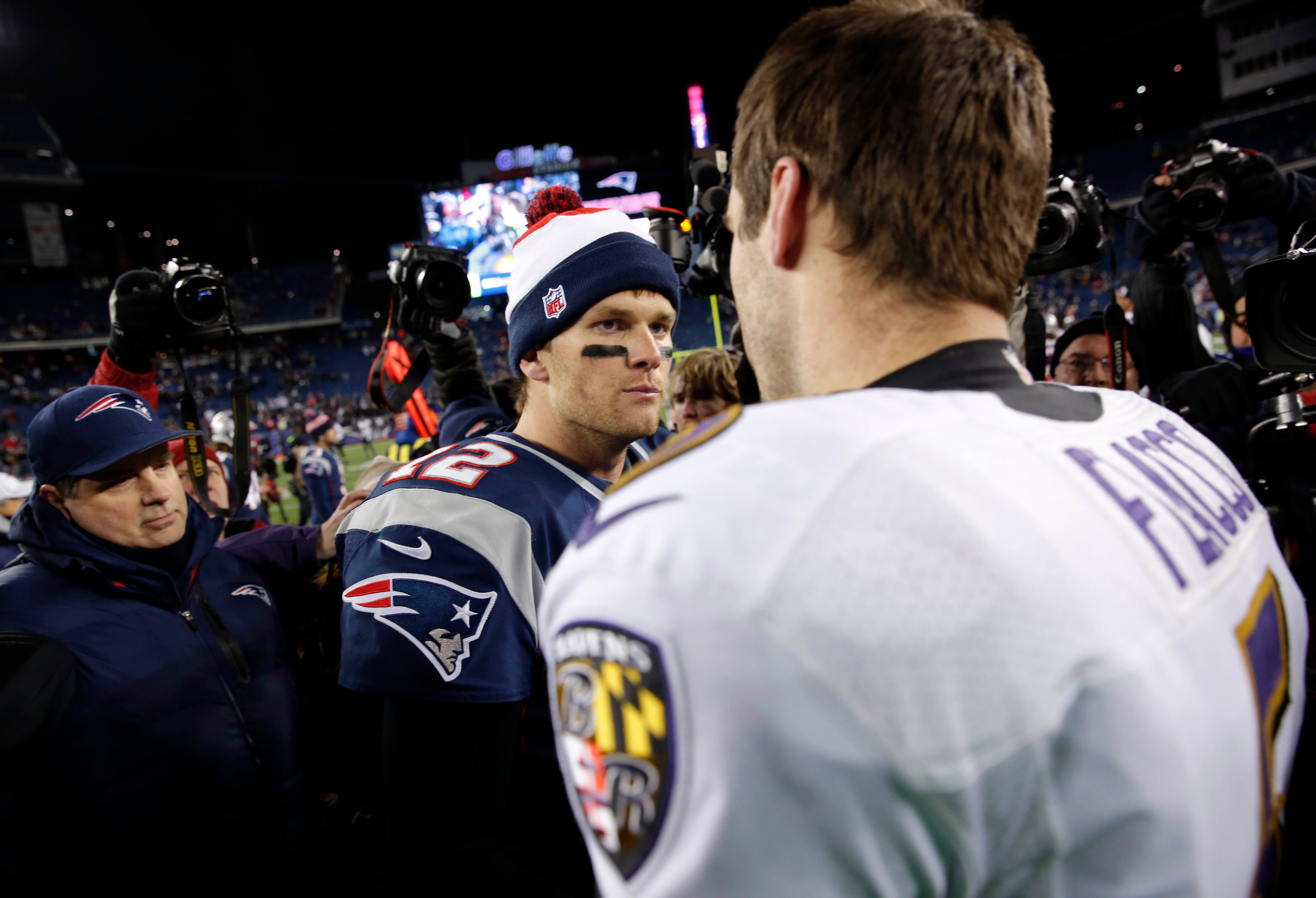 New England Patriots quarterback Tom Brady greets Baltimore Ravens quarterback Joe Flacco after the AFC championship game at Gillette Stadium. The Ravens won 28-13.