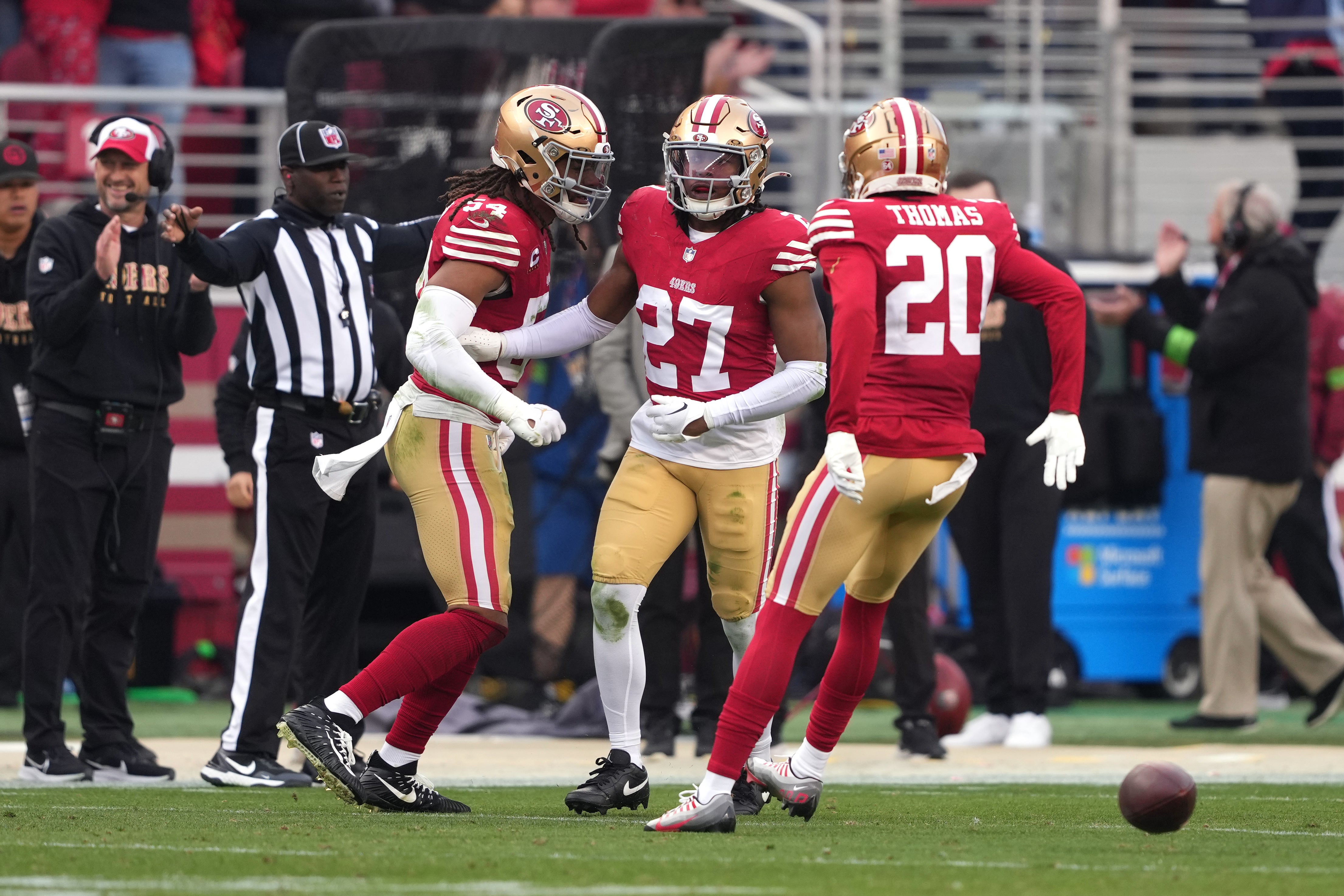 Dec 10, 2023; Santa Clara, California, USA; San Francisco 49ers safety Ji'Ayir Brown (27) is congratulated by linebacker Fred Warner (54) and cornerback Ambry Thomas (20) after intercepting a pass against the Seattle Seahawks during the fourth quarter at Levi's Stadium.