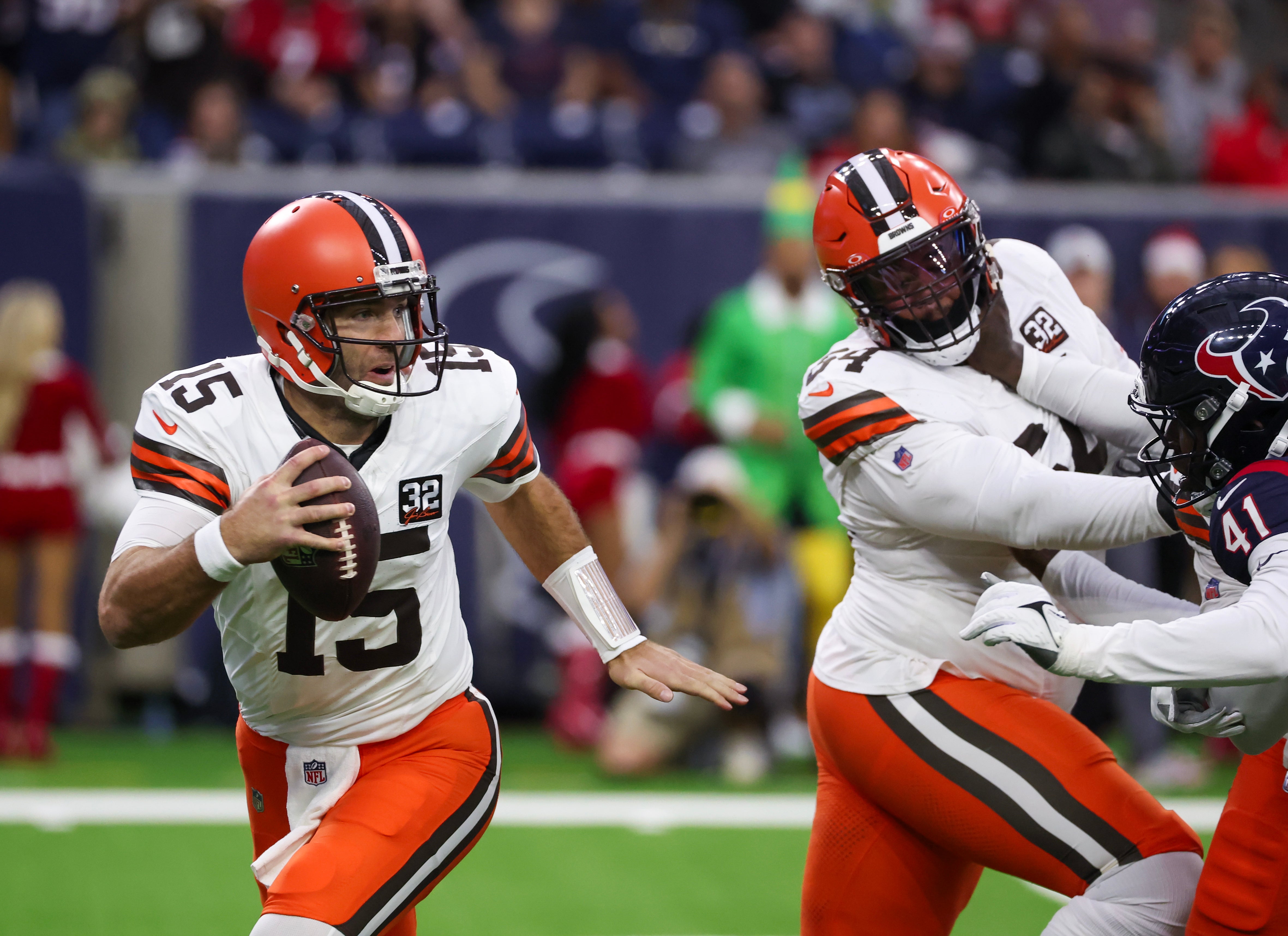 Dec 24, 2023; Houston, Texas, USA; Cleveland Browns quarterback Joe Flacco (15) scrambles against the Houston Texans in the first quarter at NRG Stadium. Mandatory Credit: Thomas Shea-USA TODAY Sports