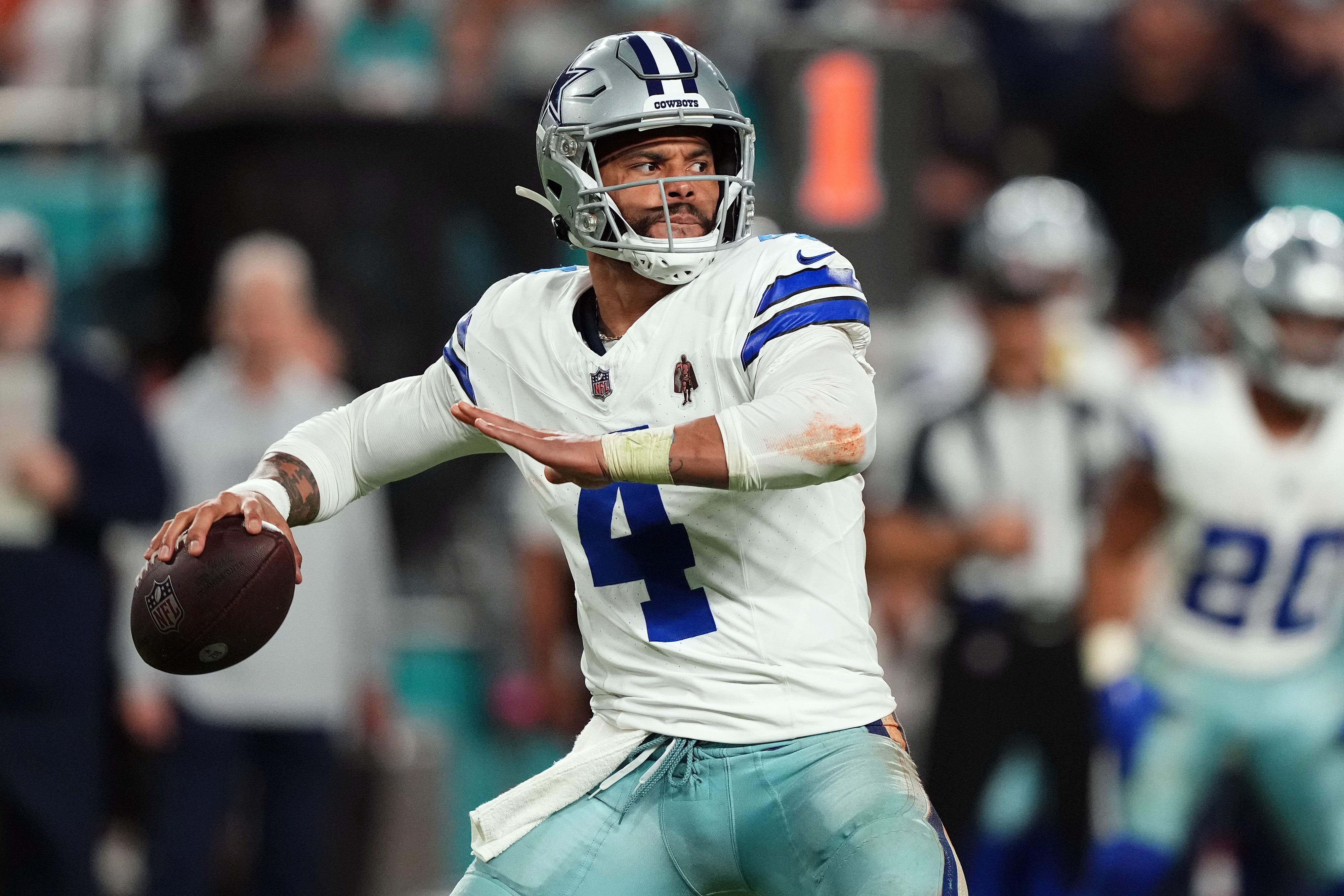 Dallas Cowboys quarterback Dak Prescott (4) attempts a pass against the Miami Dolphins during the second half at Hard Rock Stadium.