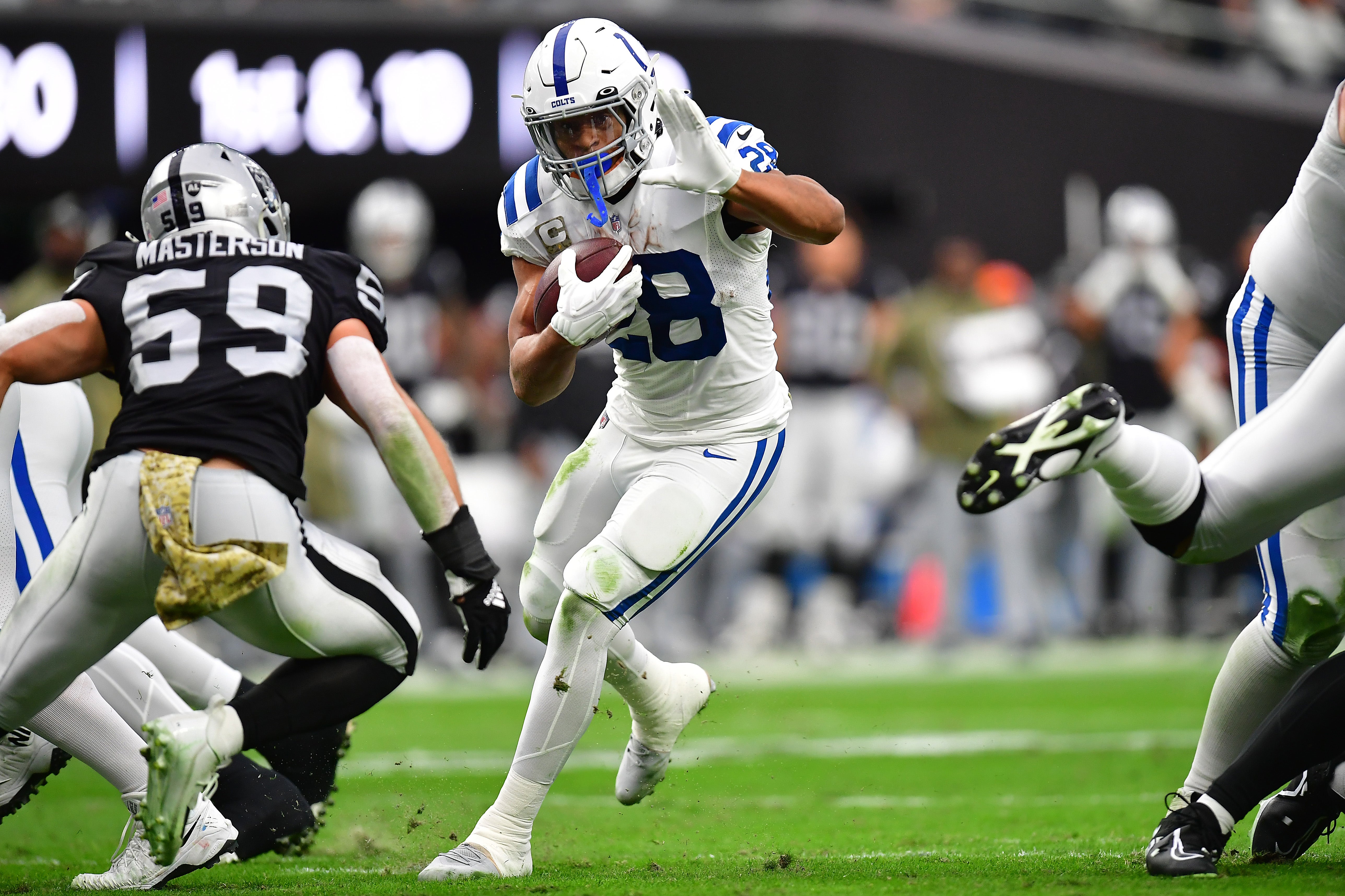 Nov 13, 2022; Paradise, Nevada, USA; Indianapolis Colts running back Jonathan Taylor (28) runs the ball against Las Vegas Raiders linebacker Luke Masterson (59) during the first half at Allegiant Stadium.