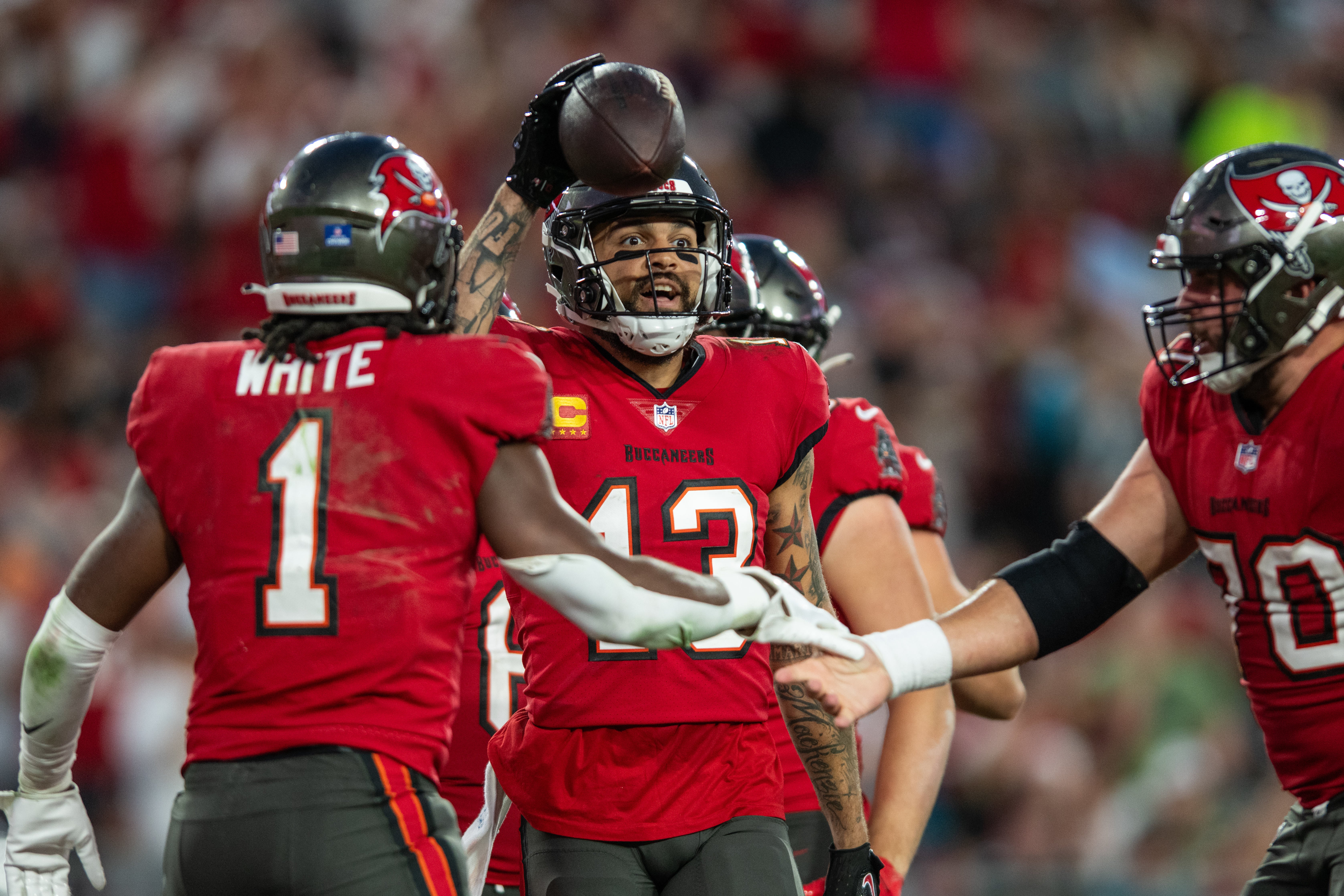 Dec 24, 2023; Tampa, Florida, USA; Tampa Bay Buccaneers wide receiver Mike Evans (13) celebrates a running back Rachaad White (1) touchdown against the Jacksonville Jaguars in the third quarter at Raymond James Stadium. Mandatory Credit: Jeremy Reper-USA TODAY Sports