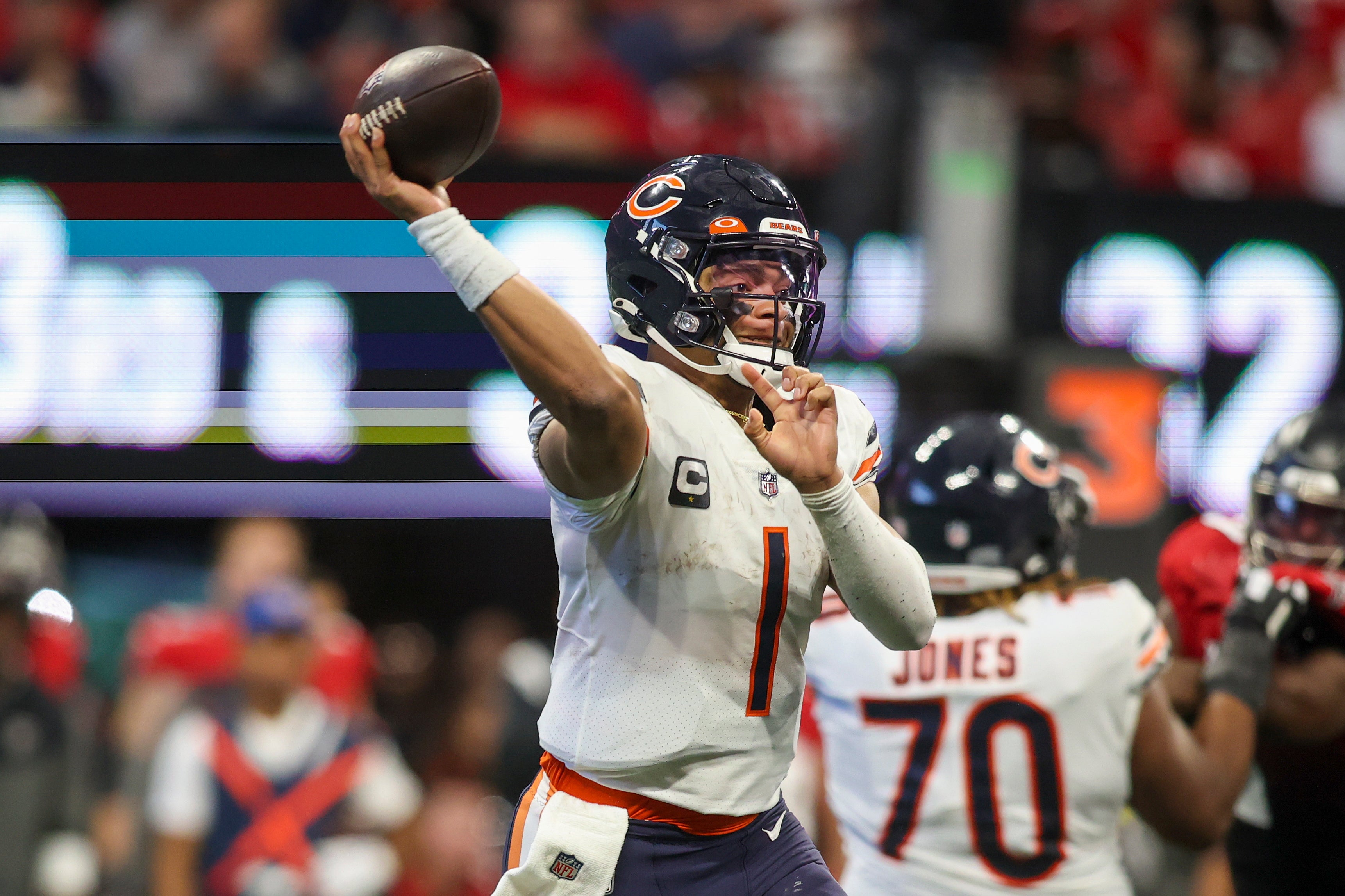 Nov 20, 2022; Atlanta, Georgia, USA; Chicago Bears quarterback Justin Fields (1) throws a pass against the Atlanta Falcons in the second half at Mercedes-Benz Stadium.