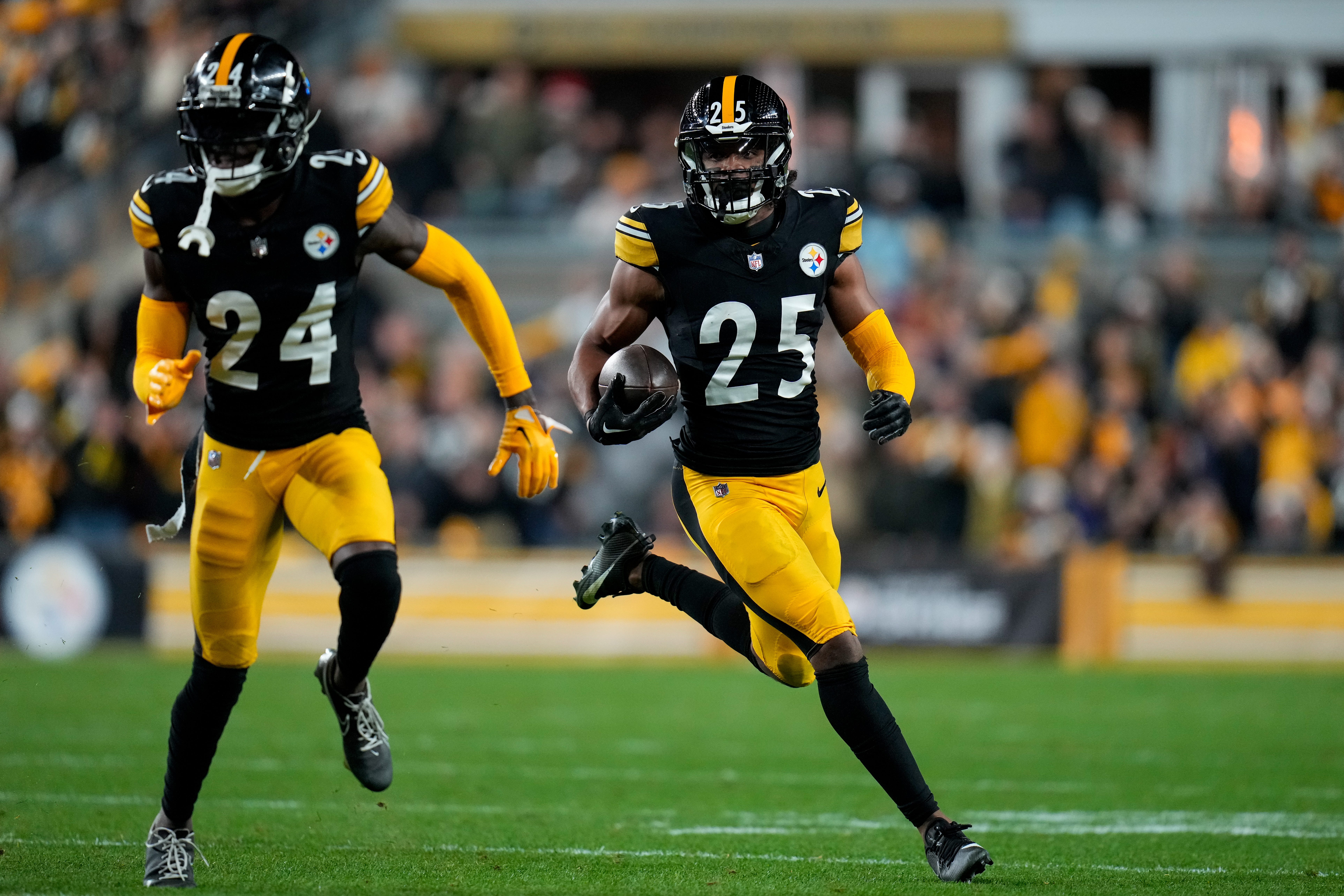 Pittsburgh Steelers safety Eric Rowe (25) runs back an intercepted pass in the second quarter of the NFL 16 game between the Pittsburgh Steelers and the Cincinnati Bengals at Acrisure Stadium in Pittsburgh on Saturday, Dec. 23, 2023. The Steelers led 24-0 at halftime.  
