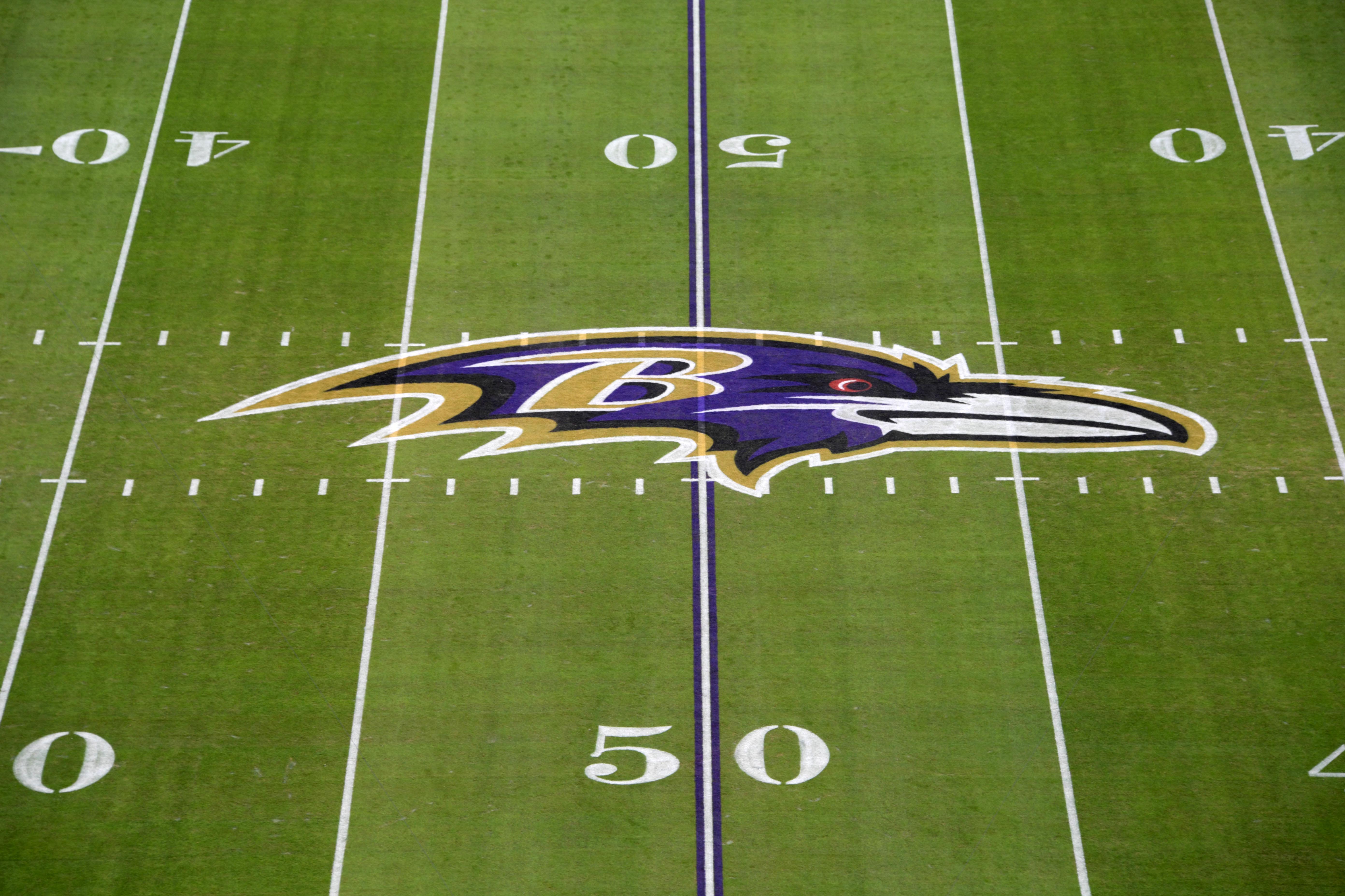 Detailed view of the Baltimore Ravens logo at midfield during an AFC Wild Card playoff football game against the Los Angeles Chargers at M&T Bank Stadium