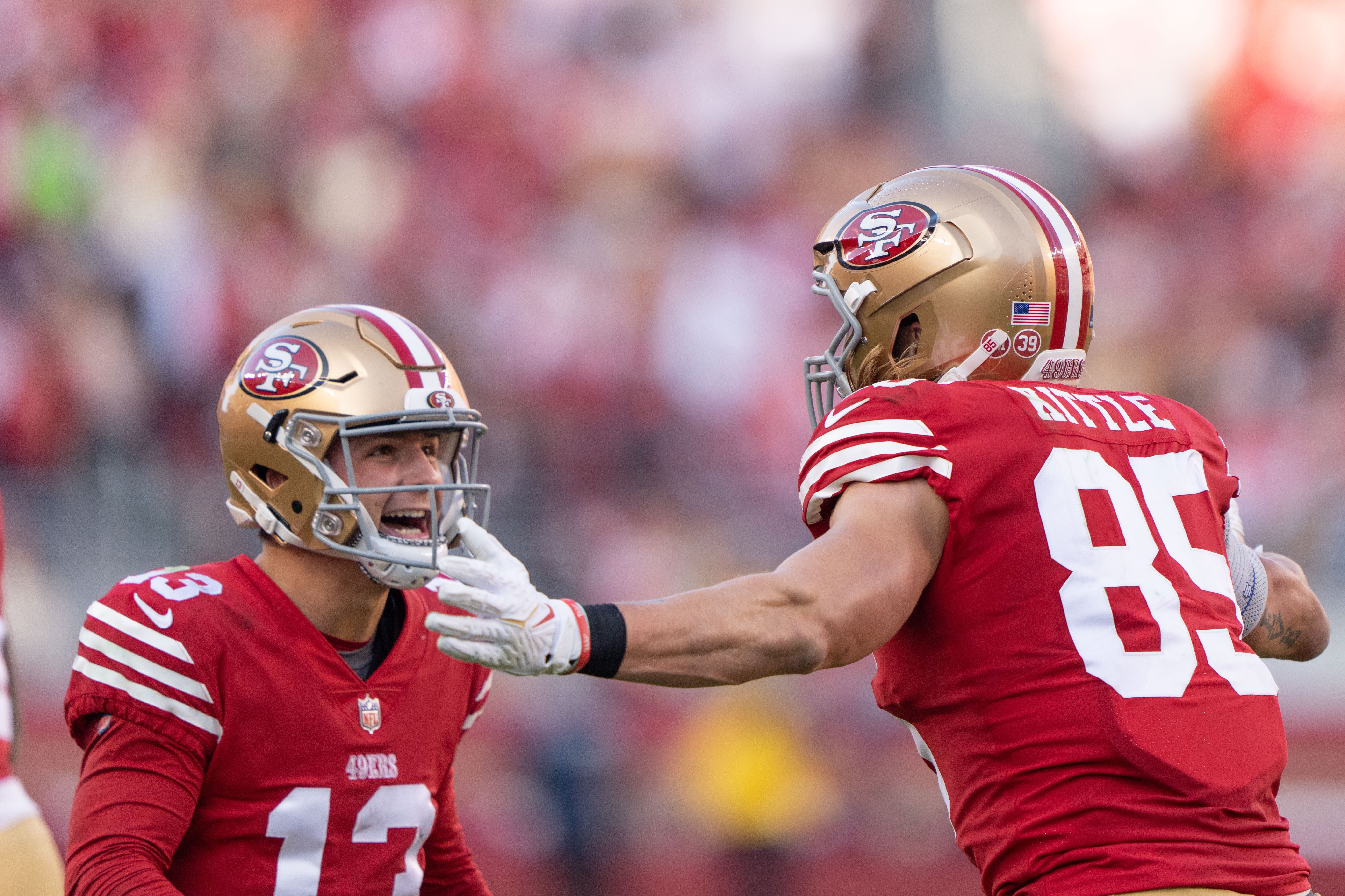 Dec 24, 2022; Santa Clara, California, USA; San Francisco 49ers quarterback Brock Purdy (13) and tight end George Kittle (85) celebrate during the third quarter against the Washington Commanders at Levi's Stadium.
