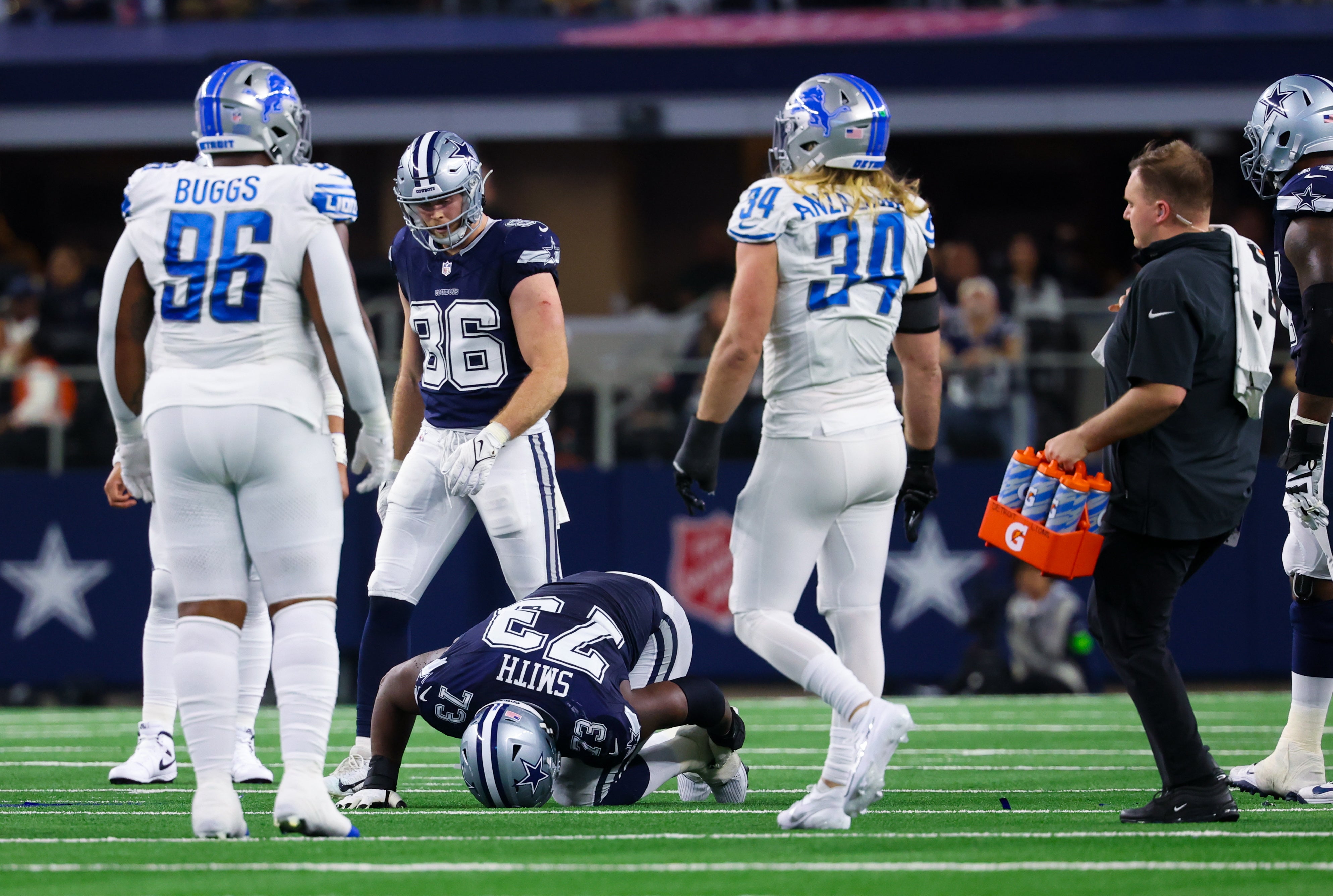 Dallas Cowboys offensive tackle Tyler Smith (73) lays injured during the second half against the Detroit Lions at AT&T Stadium.