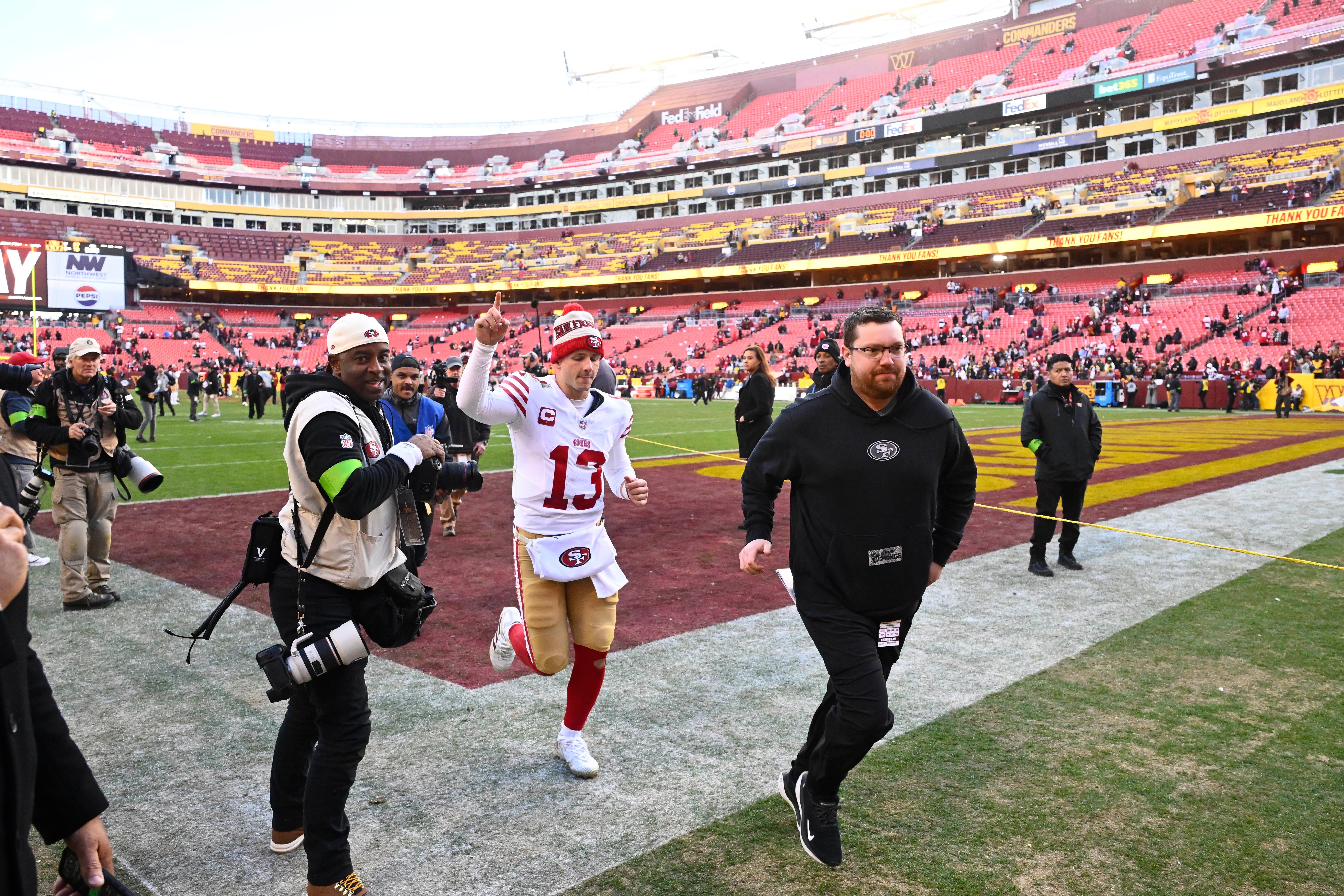 Dec 31, 2023; Landover, Maryland, USA; San Francisco 49ers quarterback Brock Purdy (13) leaves the field after defeating the Washington Commanders at FedExField.