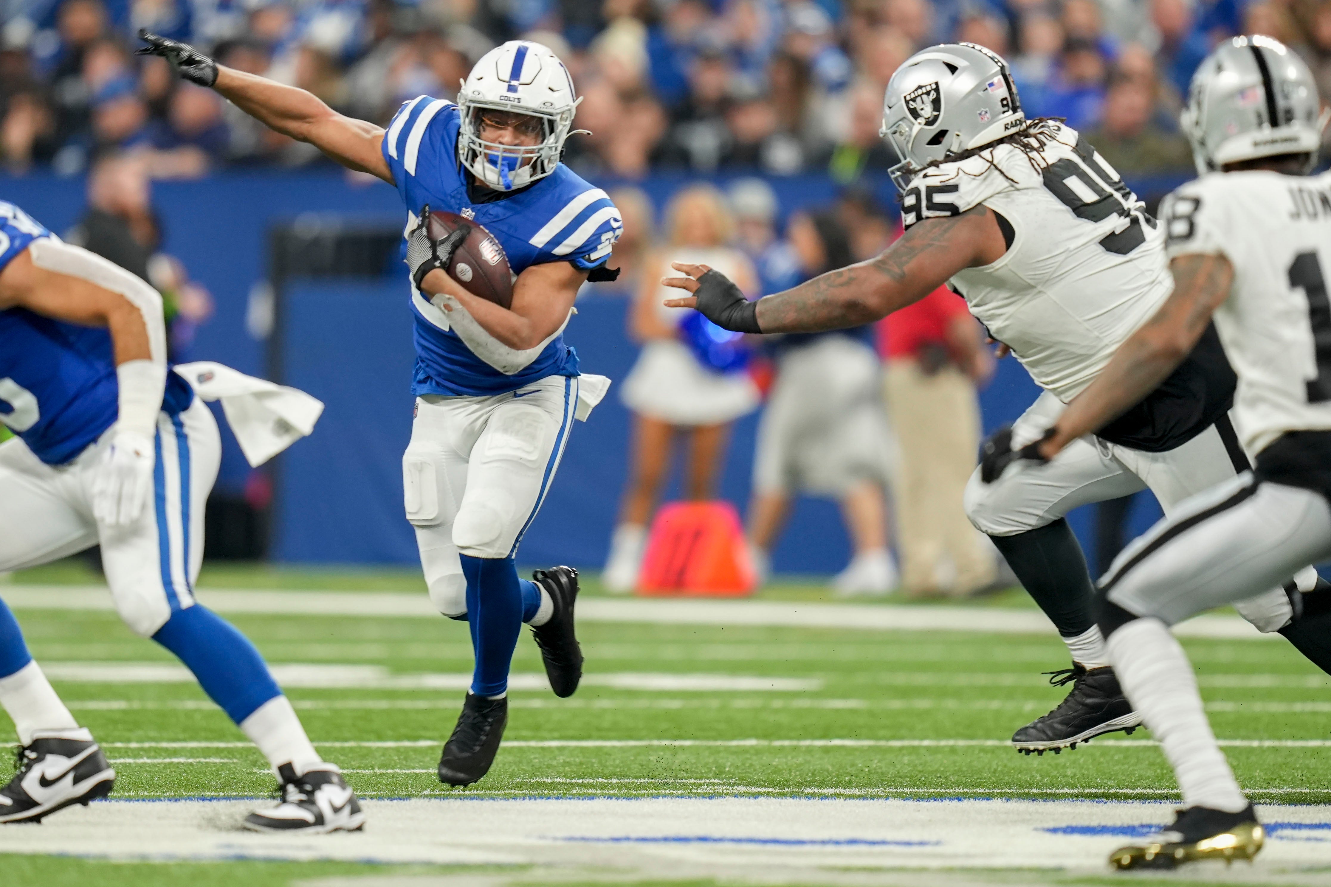 Dec 31, 2023; Indianapolis, Indiana, USA; Indianapolis Colts running back Jonathan Taylor (28) rushes the ball during a game against the Las Vegas Raiders at Lucas Oil Stadium.