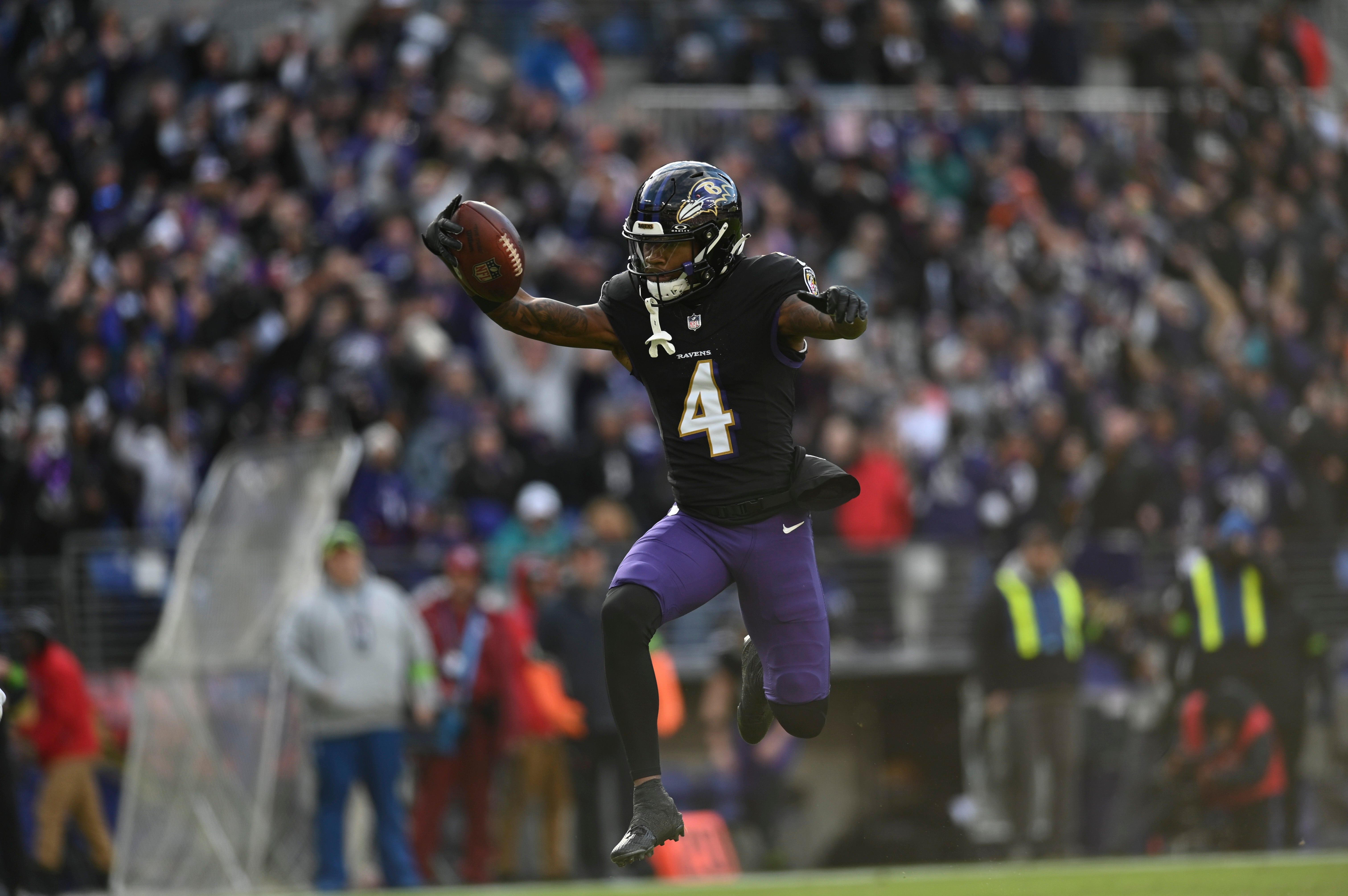 Baltimore Ravens wide receiver Zay Flowers (4) leaps into the endzone for a touchdown during the second quarter against the Miami Dolphins at M&T Bank Stadium.