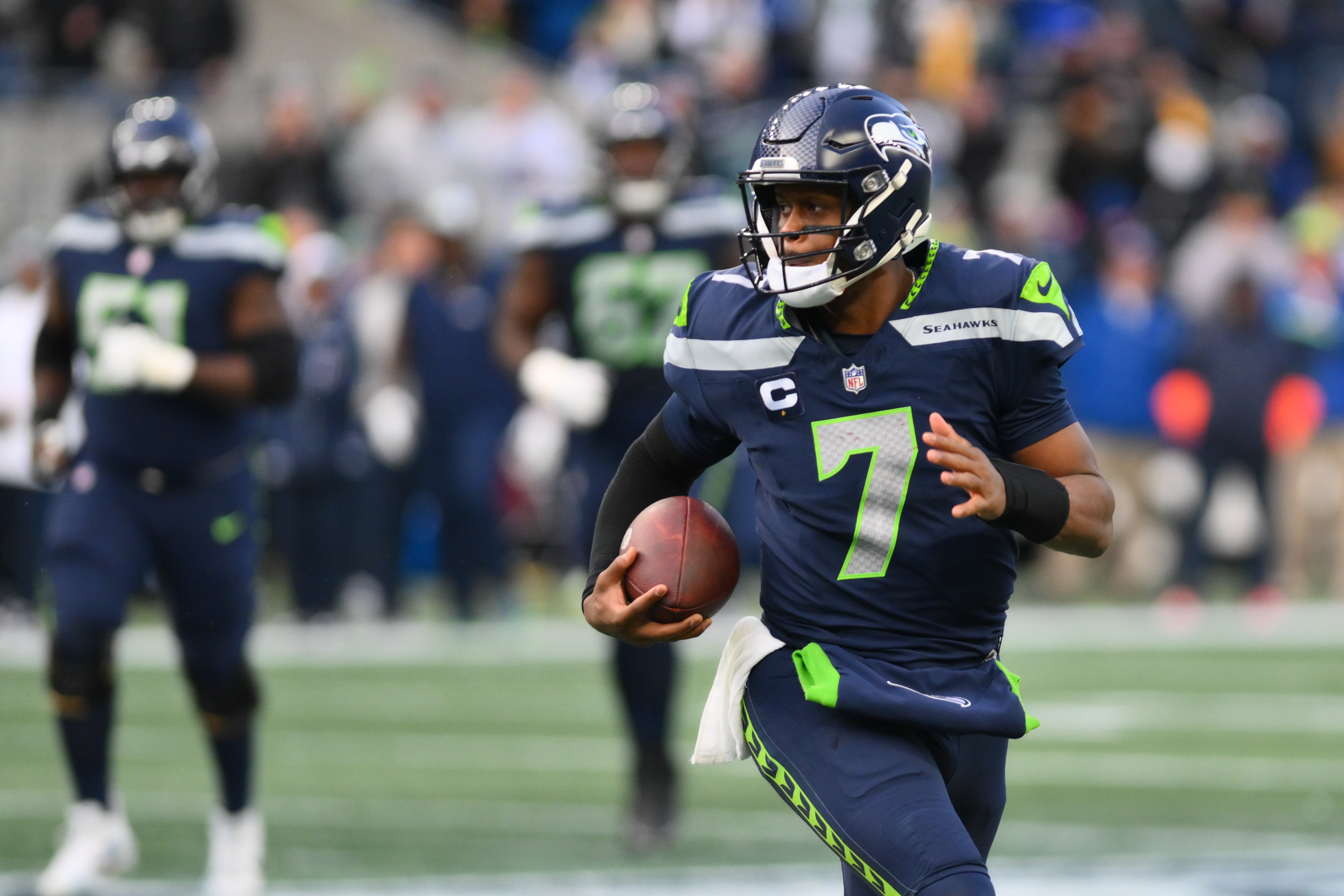 Dec 31, 2023; Seattle, Washington, USA; Seattle Seahawks quarterback Geno Smith (7) carries the ball against the Pittsburgh Steelers during the second half at Lumen Field. Mandatory Credit: Steven Bisig-USA TODAY Sports