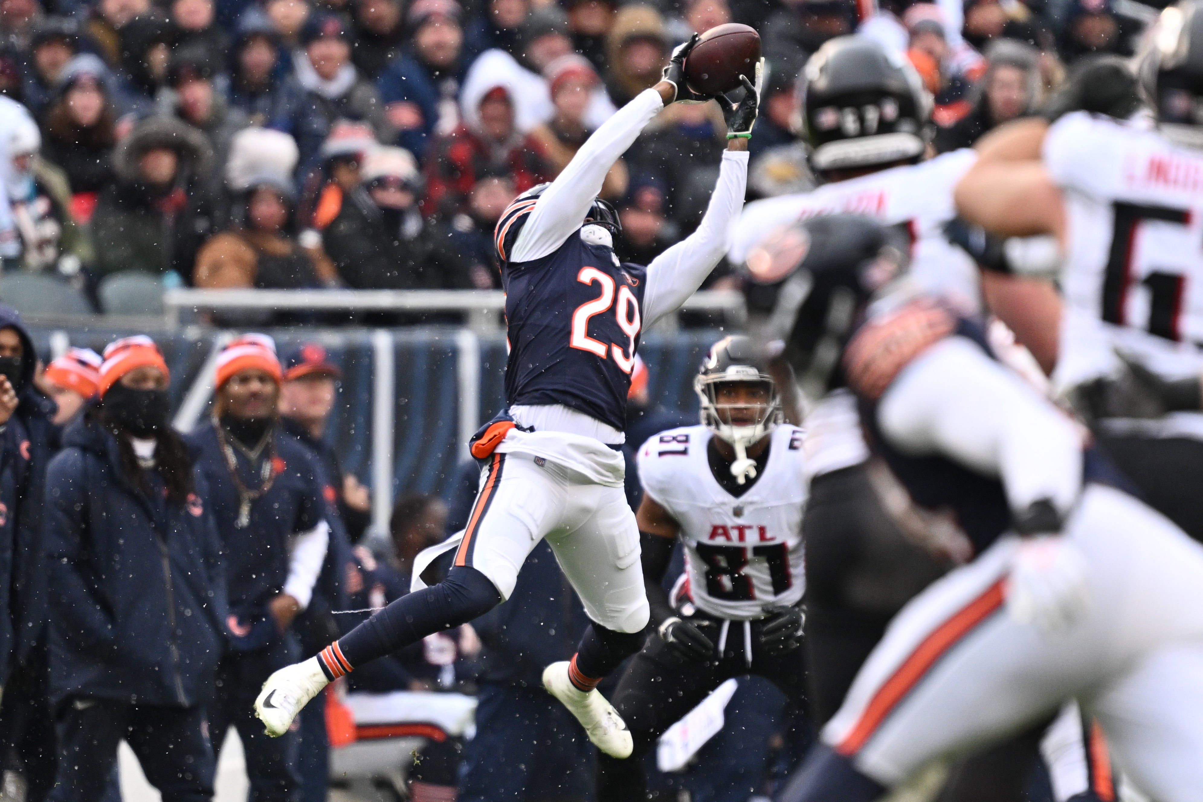 Dec 31, 2023; Chicago, Illinois, USA; Chicago Bears defensive back Tyrique Stevenson (29) intercepts a pass in the second half against the Atlanta Falcons at Soldier Field.