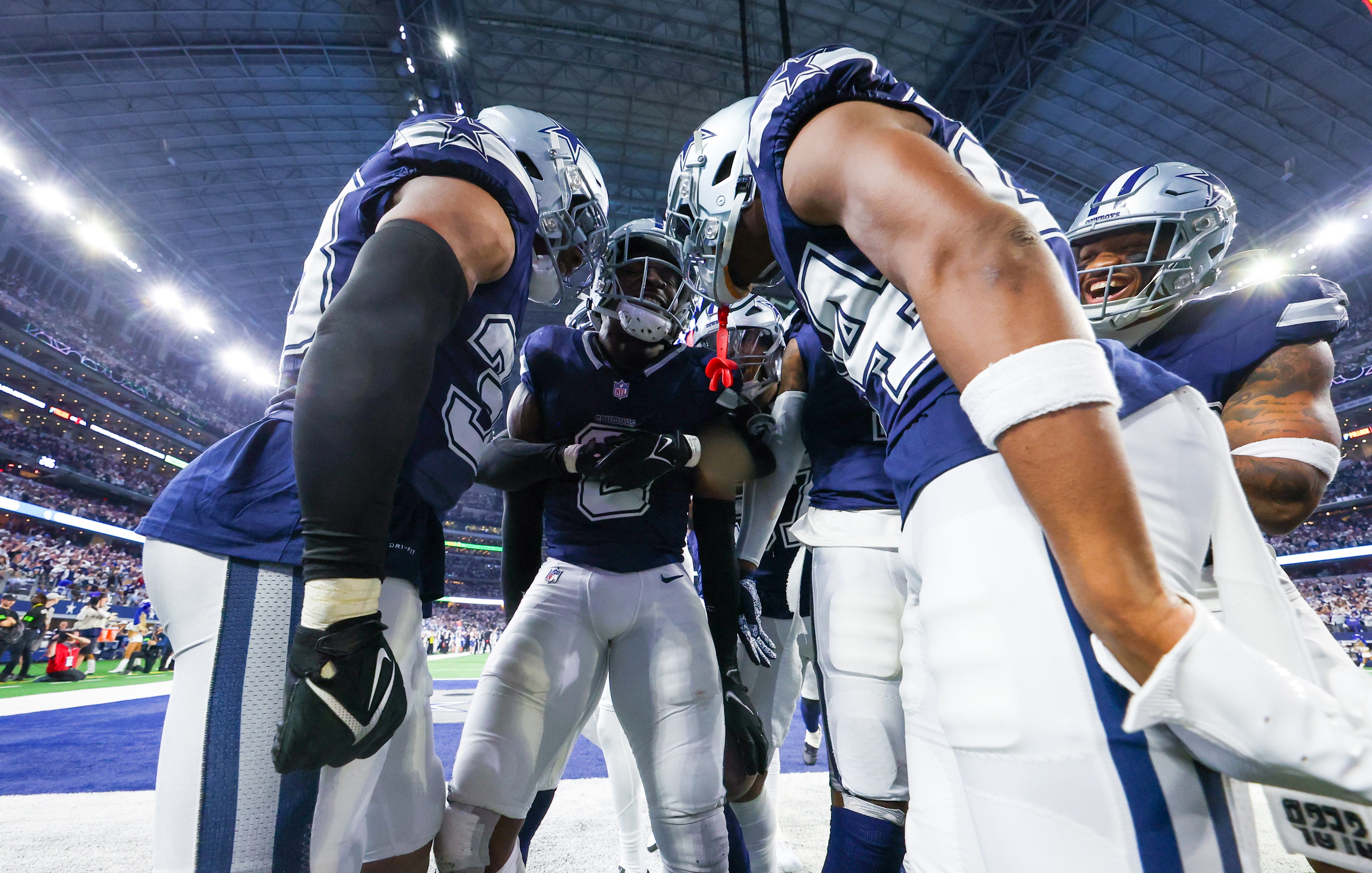 Donovan Wilson celebrates with his teammates after his interception vs Detroit