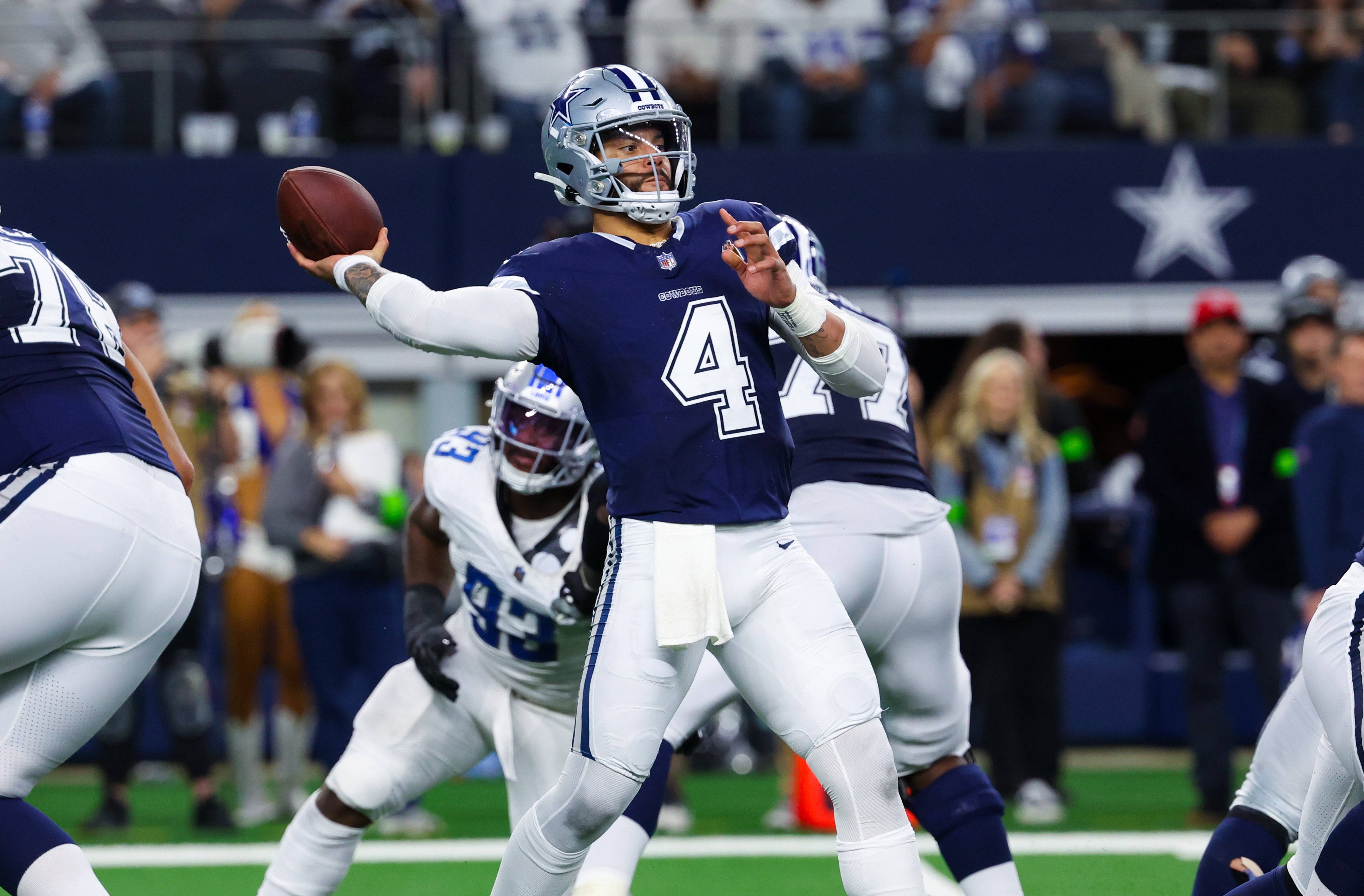 Dallas Cowboys quarterback Dak Prescott (4) throws during the second half against the Detroit Lions at AT&T Stadium.
