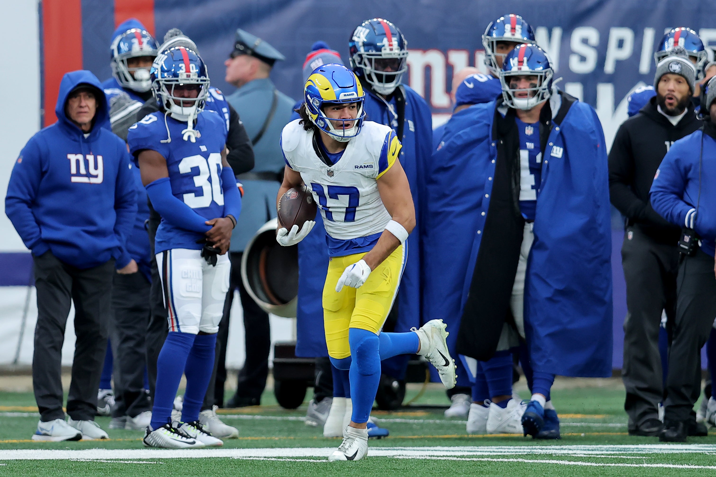 Dec 31, 2023; East Rutherford, New Jersey, USA; Los Angeles Rams wide receiver Puka Nacua (17) runs with the ball against the New York Giants during the third quarter at MetLife Stadium. Mandatory Credit: Brad Penner-USA TODAY Sports