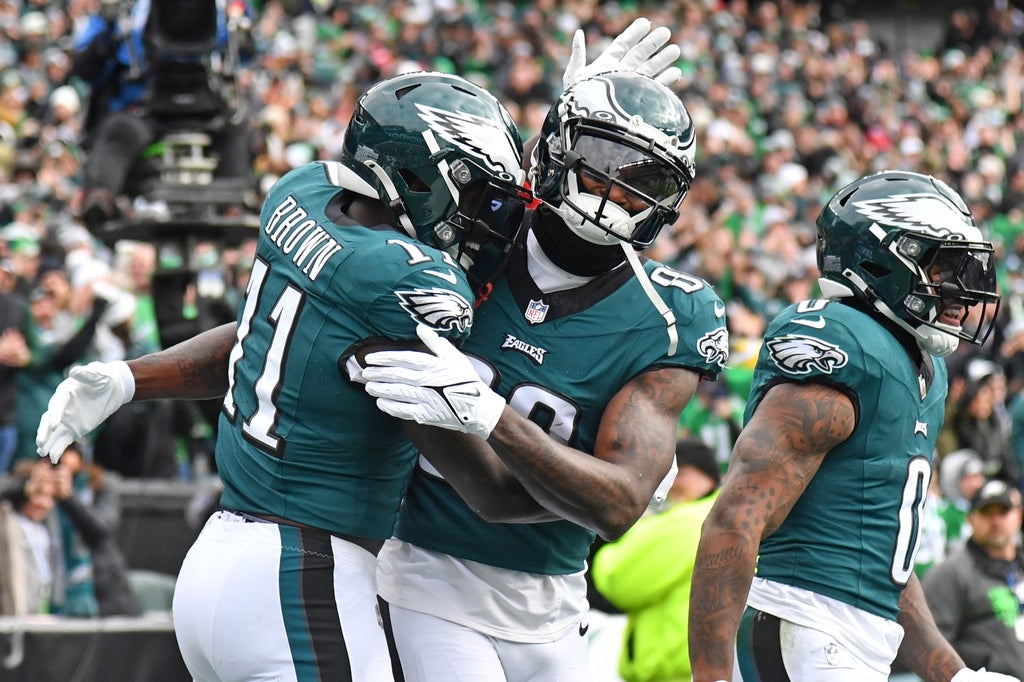 Philadelphia Eagles wide receiver Julio Jones (80) celebrates his 12-yard touchdown with wide receiver A.J. Brown (11) against the Arizona Cardinals during the first quarter at Lincoln Financial Field.