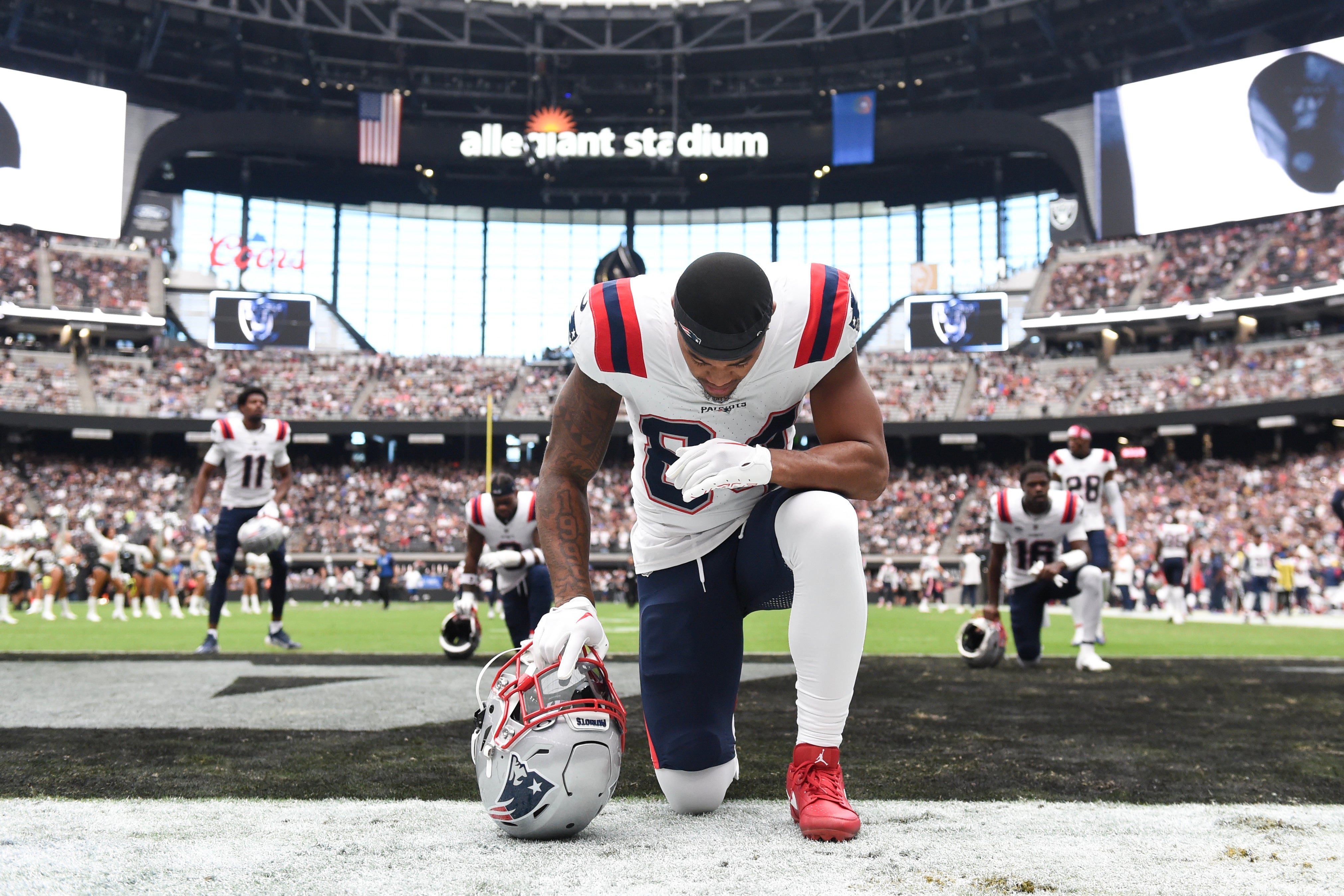New England Patriots wide receiver Kendrick Bourne takes a moment before the game against the Las Vegas Raiders at Allegiant Stadium.