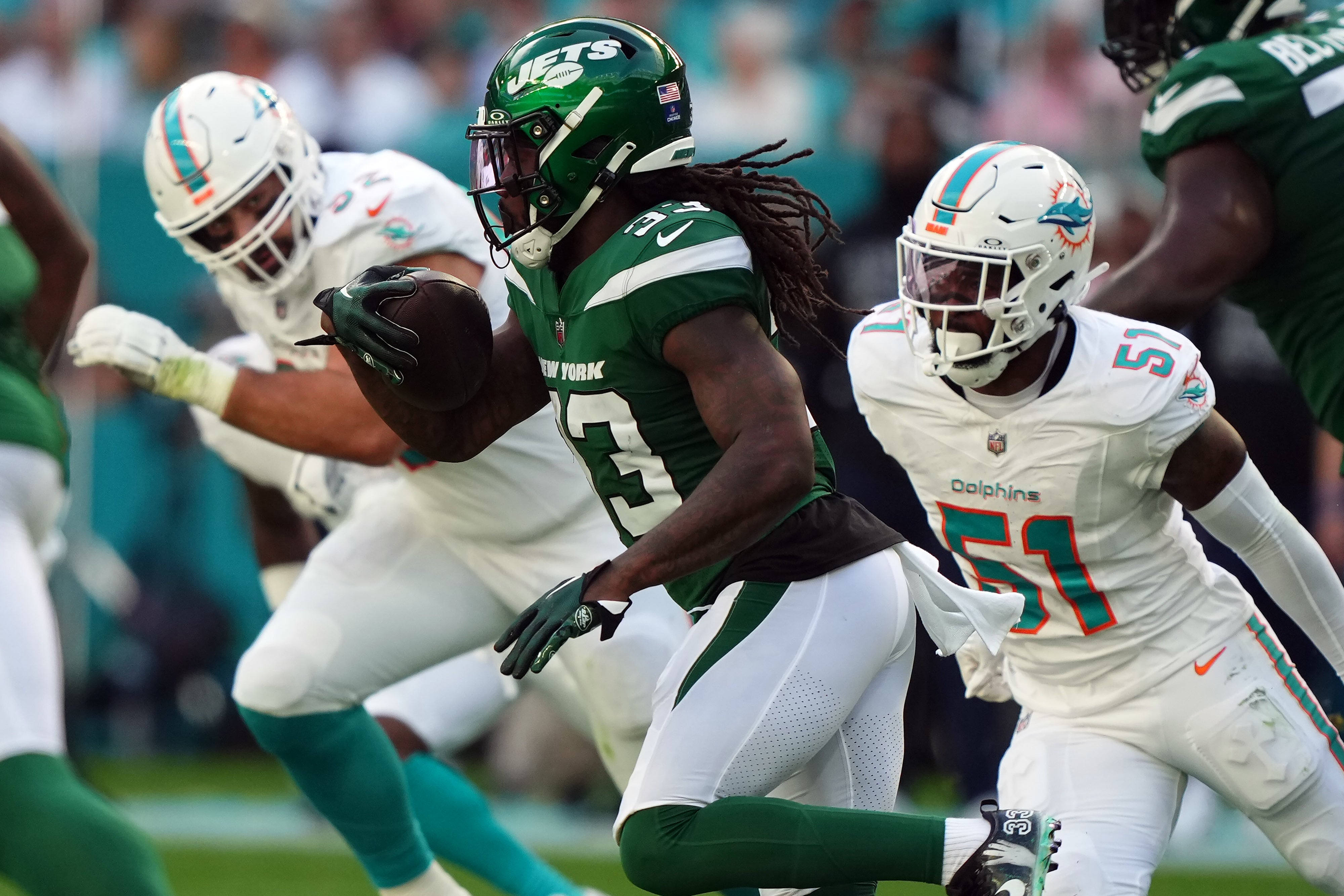 New York Jets running back Dalvin Cook rushes with the ball against the Miami Dolphins during the first half at Hard Rock Stadium.