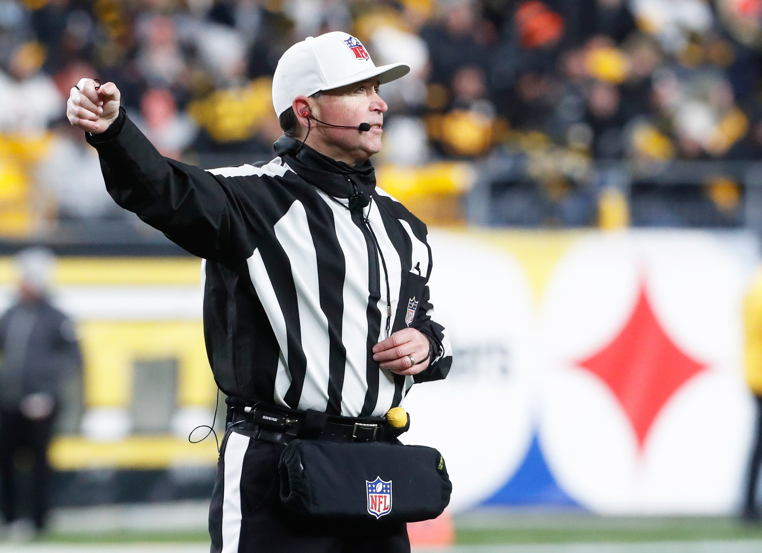 Nov 20, 2022; Pittsburgh, Pennsylvania, USA; NFL referee Brad Allen (122) signals in infraction in the second quarter of the game between the Cincinnati Bengals and the Pittsburgh Steelers at Acrisure Stadium. Mandatory Credit: Charles LeClaire-USA TODAY Sports