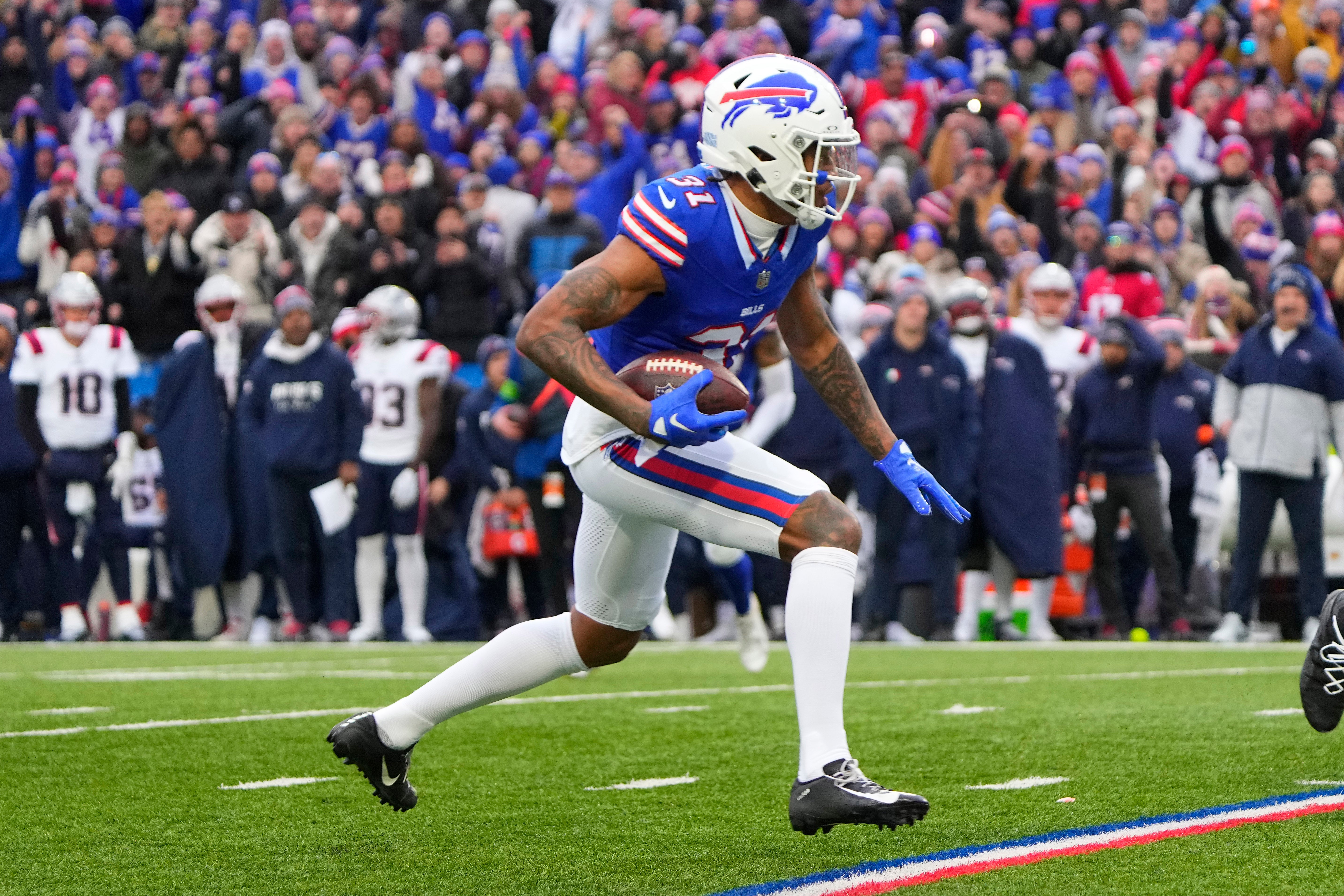 Buffalo Bills cornerback Rasul Douglas runs back an intercepted pass against the New England Patriots during the first half at Highmark Stadium