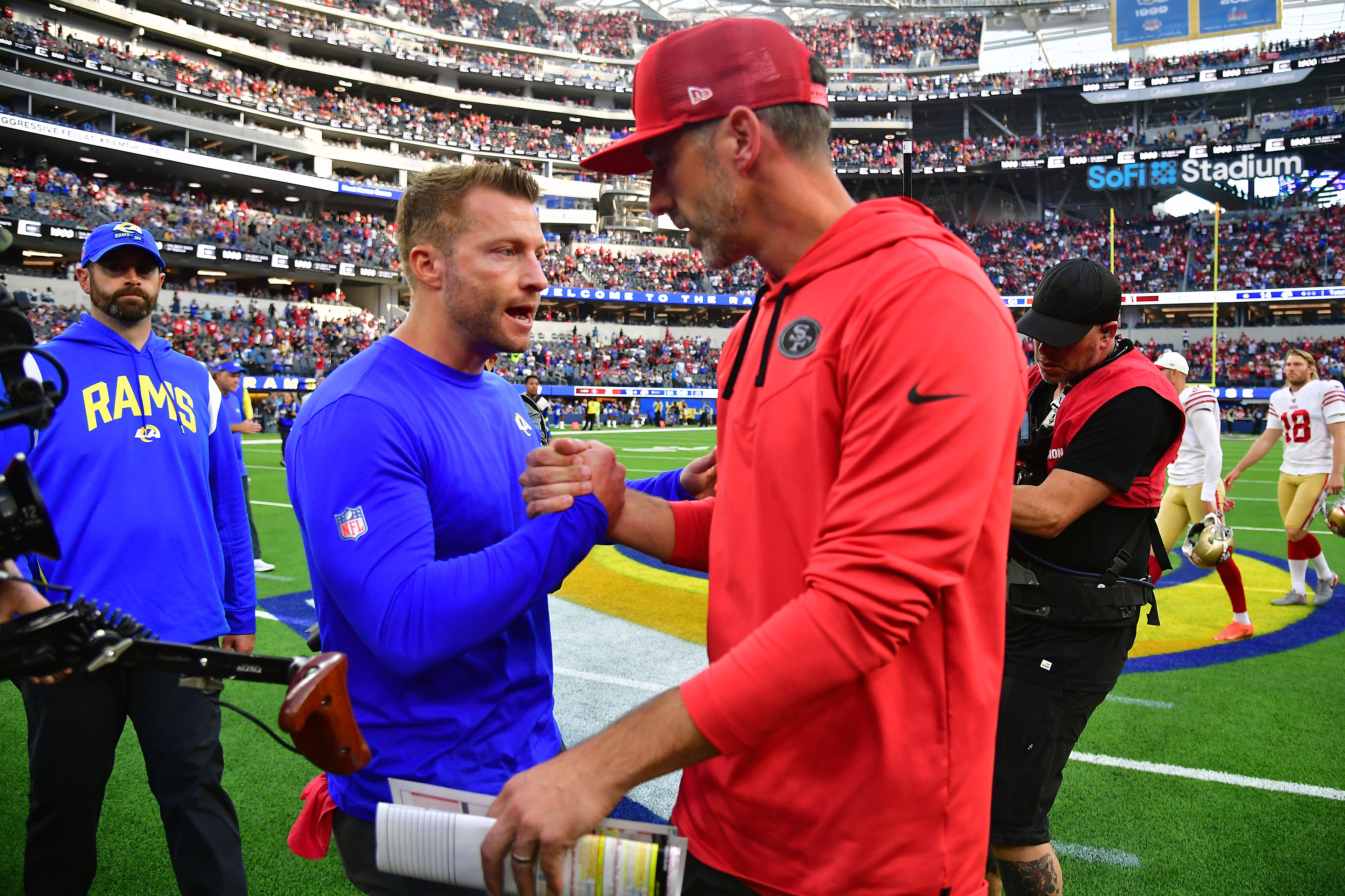 Oct 30, 2022; Inglewood, California, USA; Los Angeles Rams head coach Sean McVay meets with San Francisco 49ers head coach Kyle Shanahan following the game at SoFi Stadium.