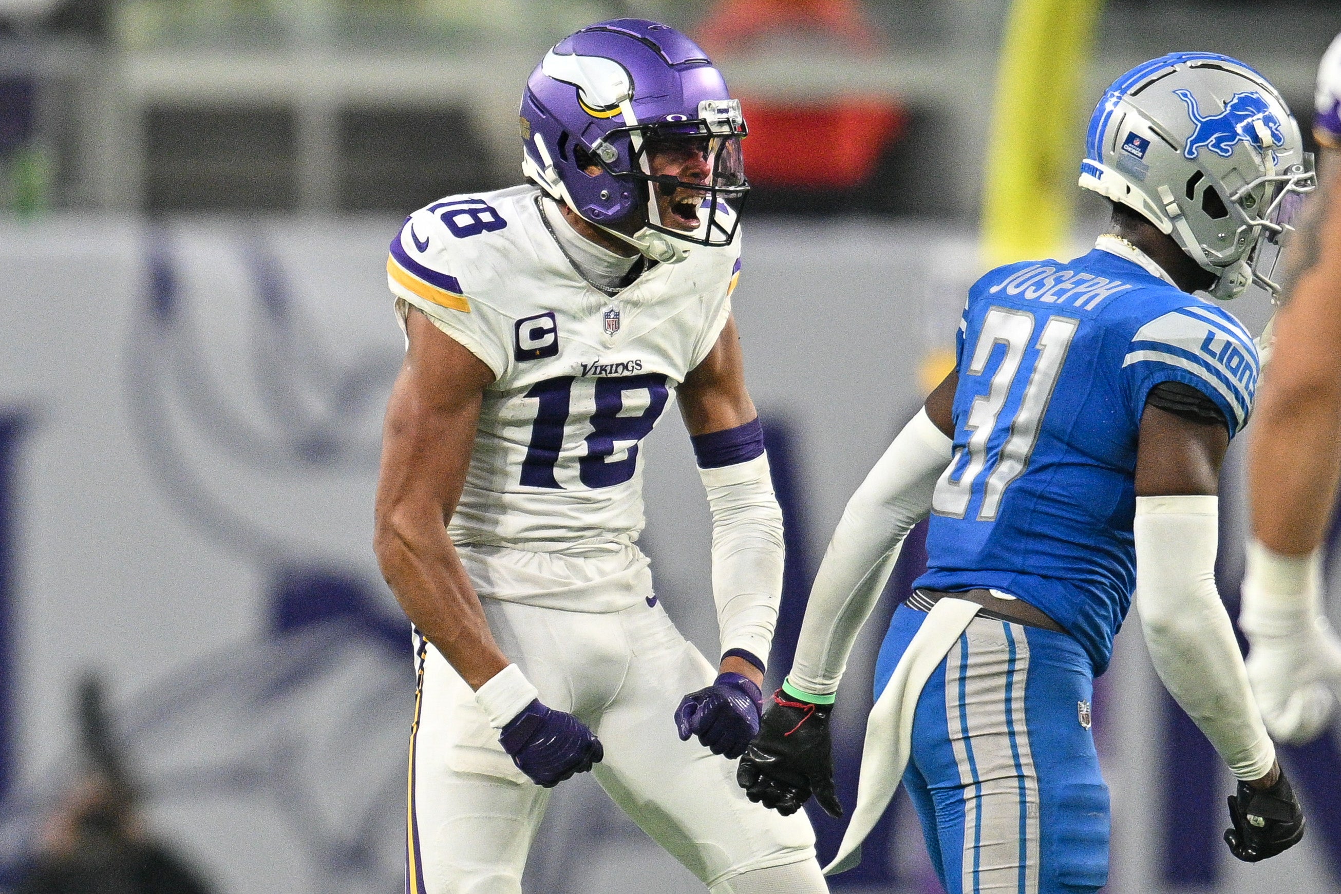 Dec 24, 2023; Minneapolis, Minnesota, USA; Minnesota Vikings wide receiver Justin Jefferson (18) reacts with Detroit Lions safety Kerby Joseph (31) during the game at U.S. Bank Stadium. Mandatory Credit: Jeffrey Becker-USA TODAY Sports