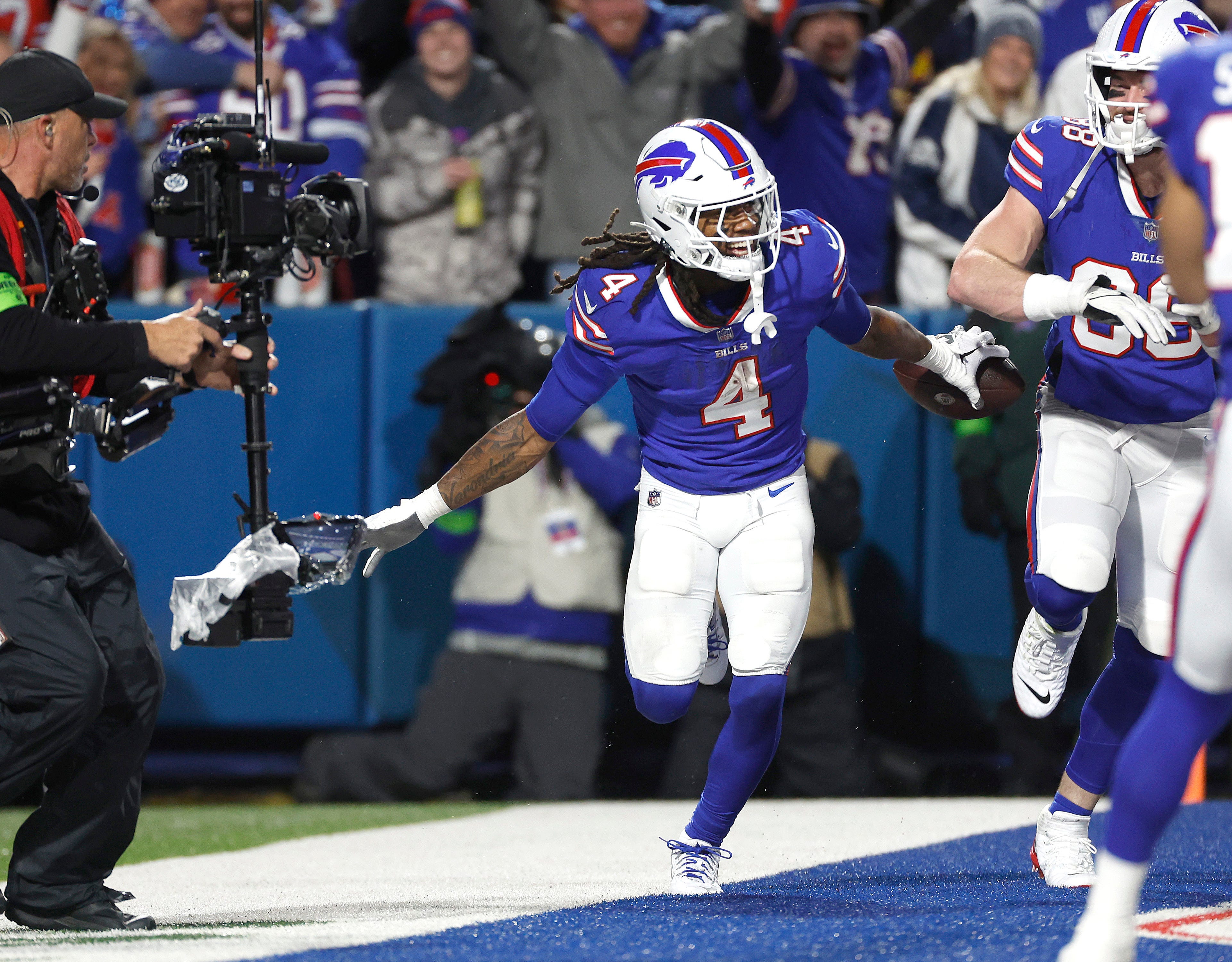 Buffalo Bills running back James Cook celebrates his 24-yard touchdown run against the Cowboys.