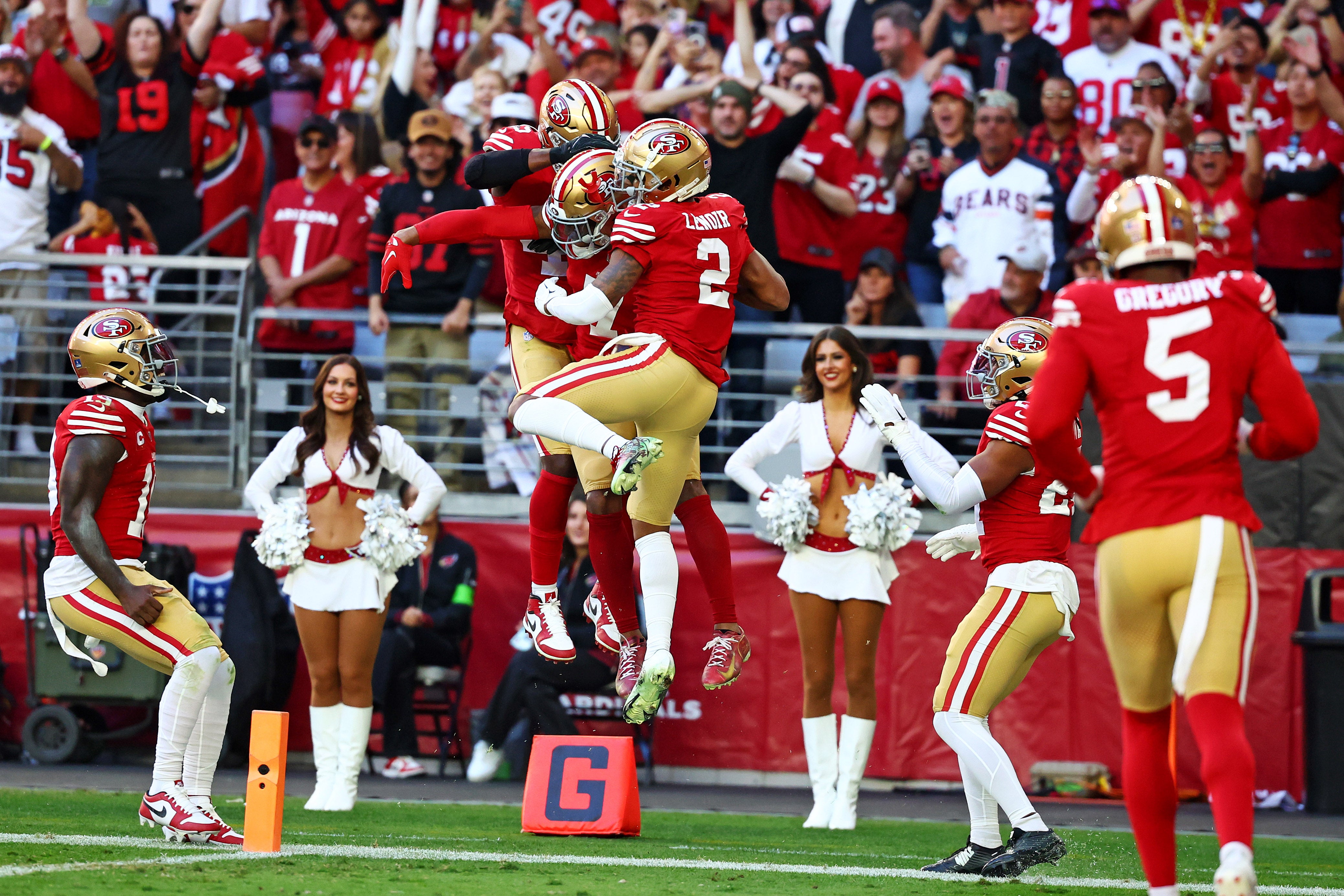 Dec 17, 2023; Glendale, Arizona, USA; San Francisco 49ers cornerback Charvarius Ward (7) celebrates after running back an interception for a touchdown during the first quarter against the Arizona Cardinals at State Farm Stadium.