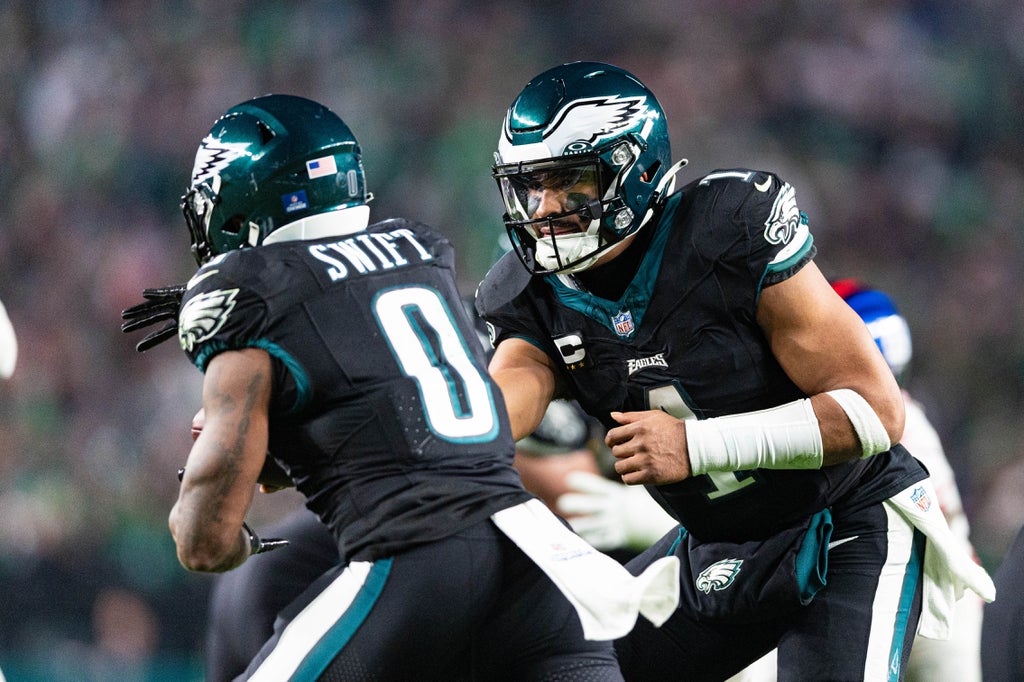 Philadelphia Eagles quarterback Jalen Hurts (1) hands off to running back D'Andre Swift (0) during the third quarter against the New York Giants at Lincoln Financial Field.