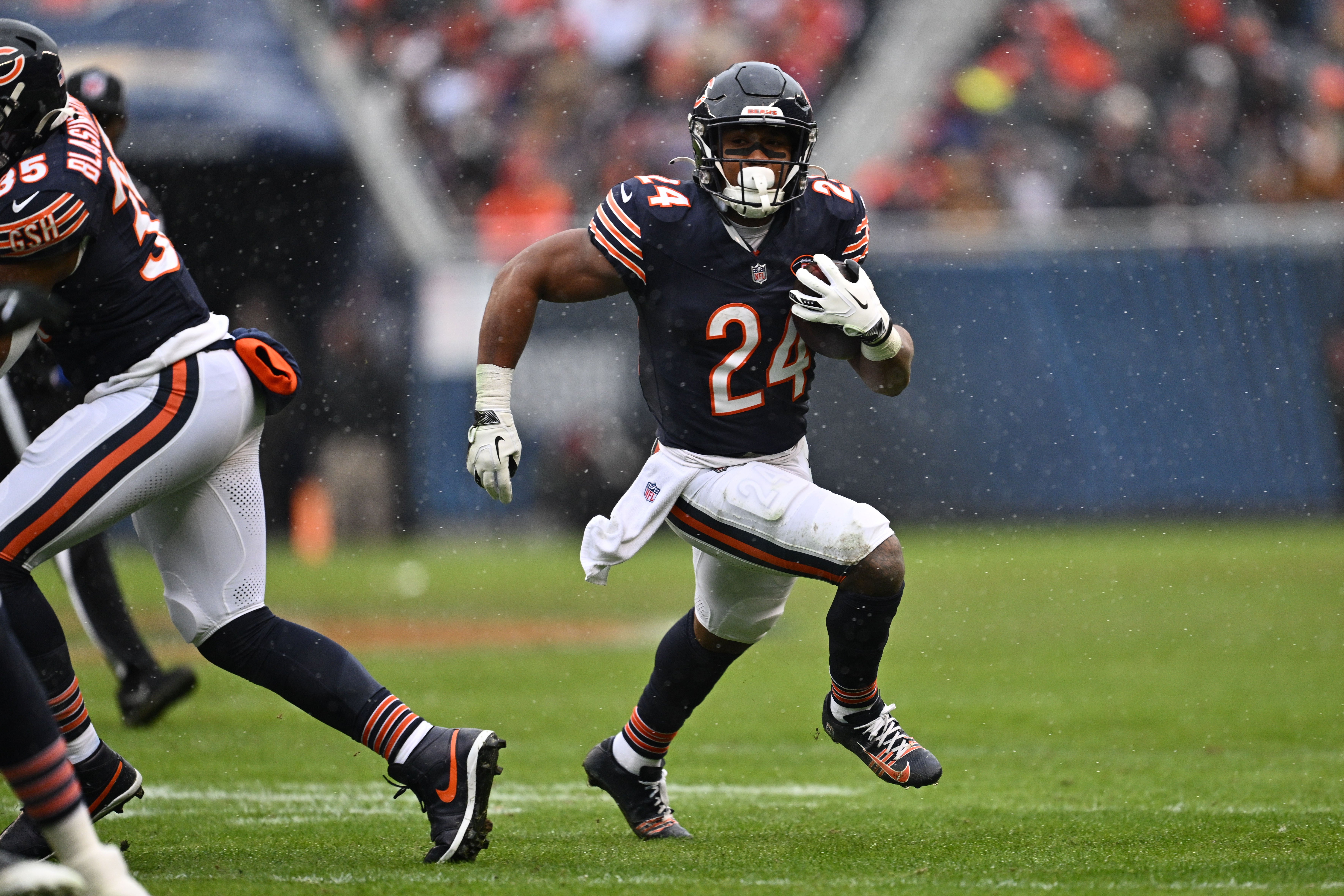 Dec 31, 2023; Chicago, Illinois, USA; Chicago Bears running back Khalil Herbert (24) gets outside to pick up a first down in the first half against the Atlanta Falcons at Soldier Field.