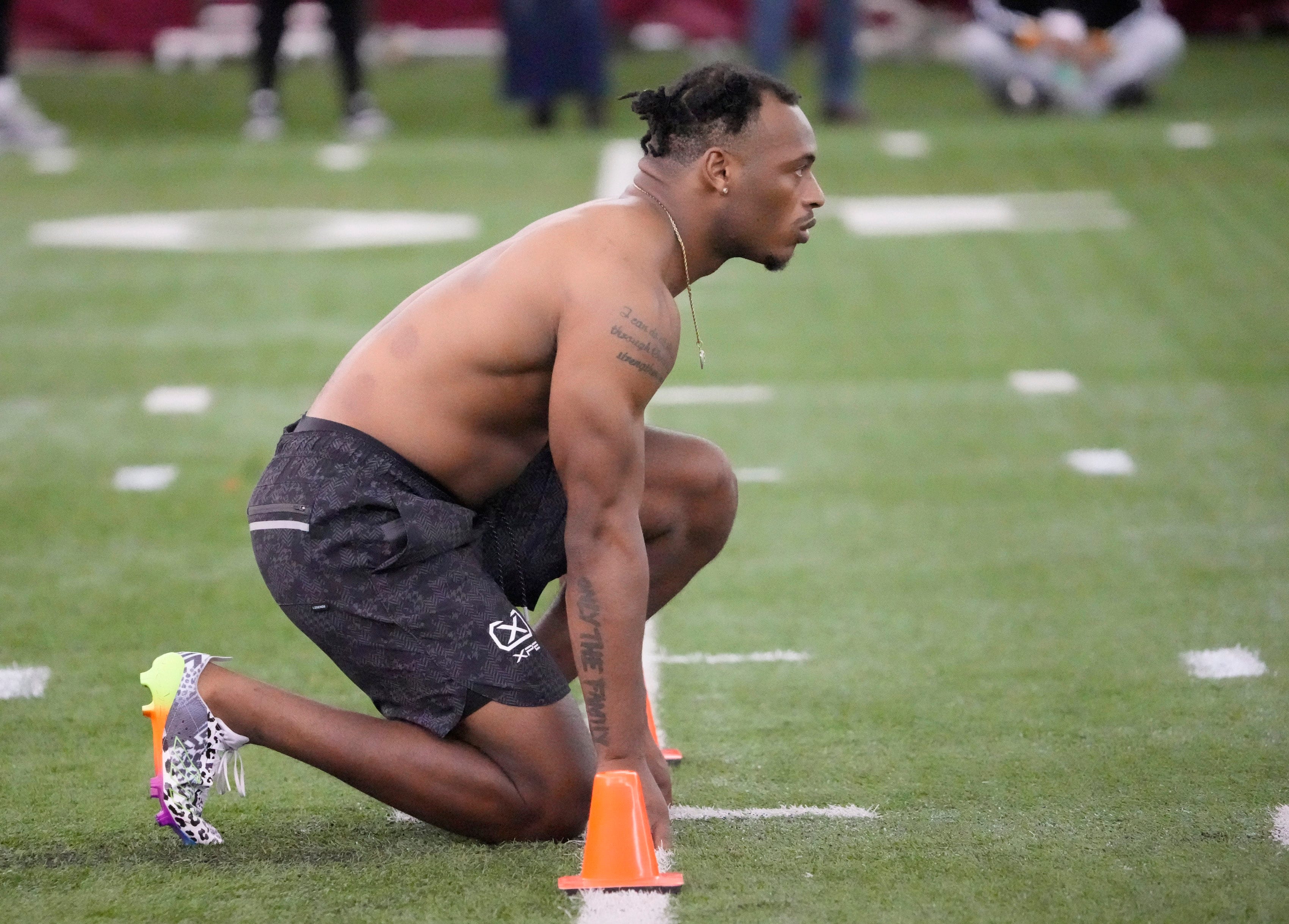 Running back Xazavian Valladay prepares to be timed on the 40-yard run during Pro Day on March 27, 2023