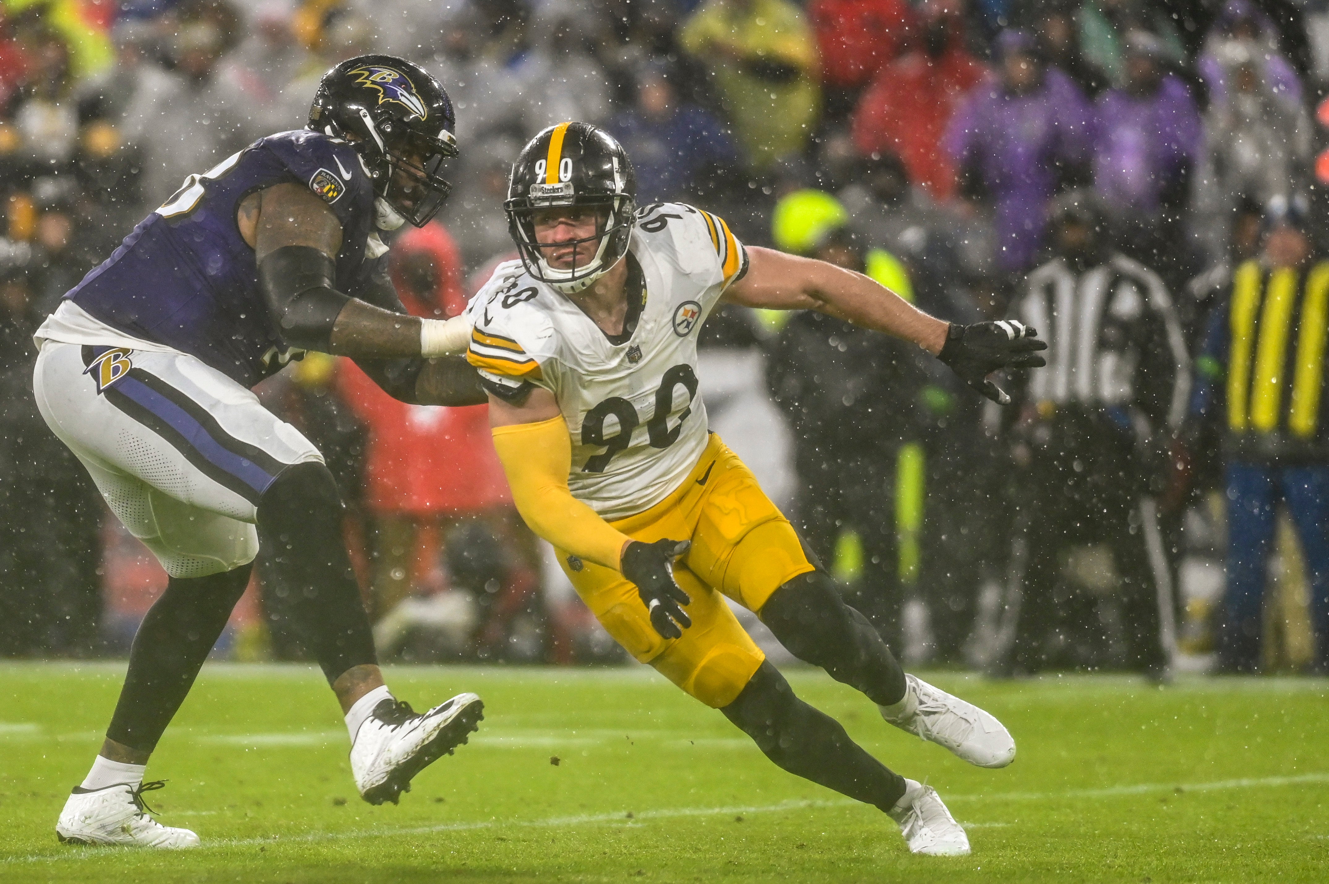 Jan 6, 2024; Baltimore, Maryland, USA; Pittsburgh Steelers linebacker T.J. Watt (90) rushes past Baltimore Ravens offensive tackle Morgan Moses (78) during the first quarter at M&T Bank Stadium. Mandatory Credit: Tommy Gilligan-USA TODAY Sports  