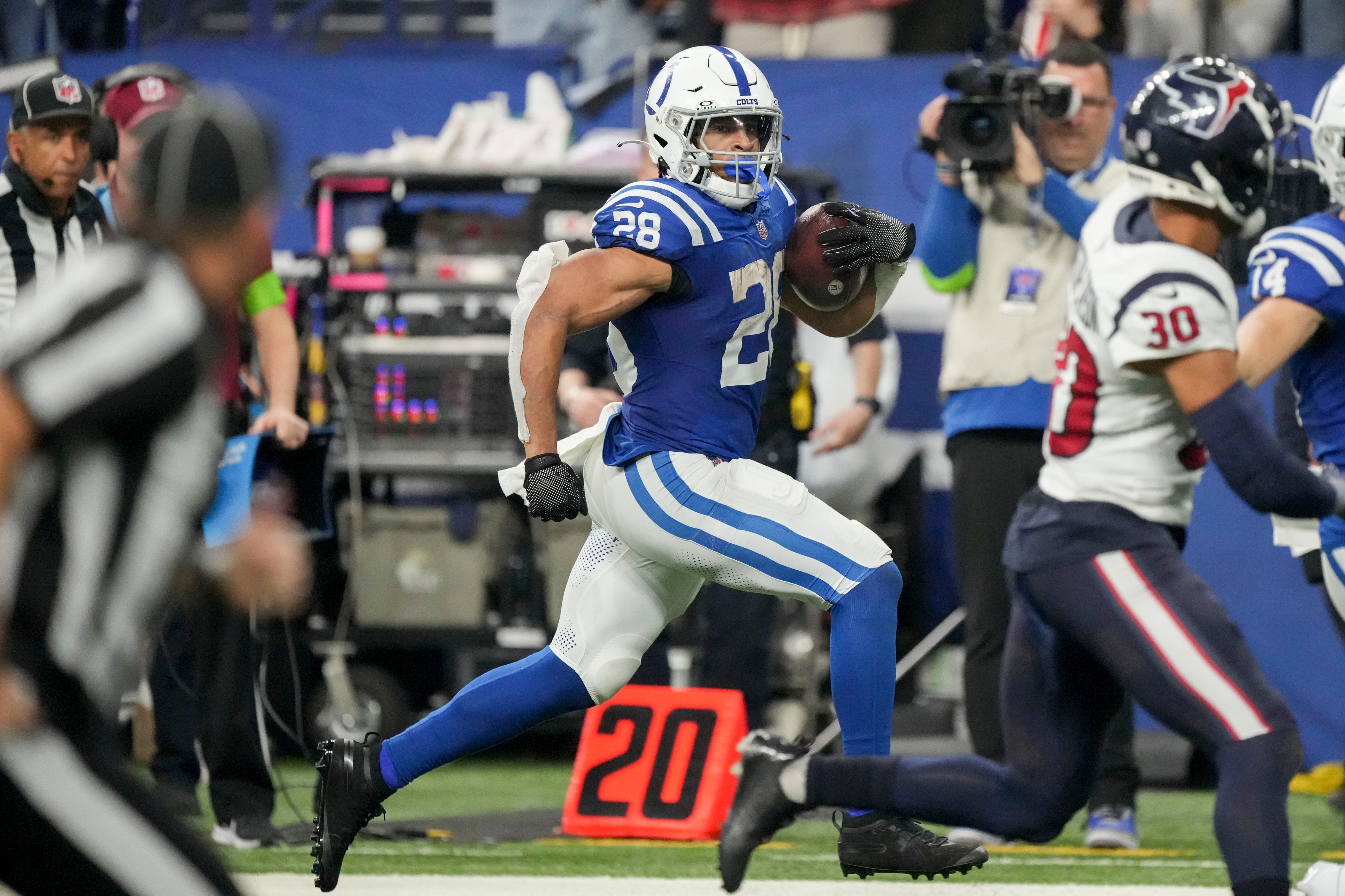 Indianapolis Colts running back Jonathan Taylor (28) rushes along the sideline Saturday, Jan. 6, 2024, during a game against the Houston Texans at Lucas Oil Stadium in Indianapolis.