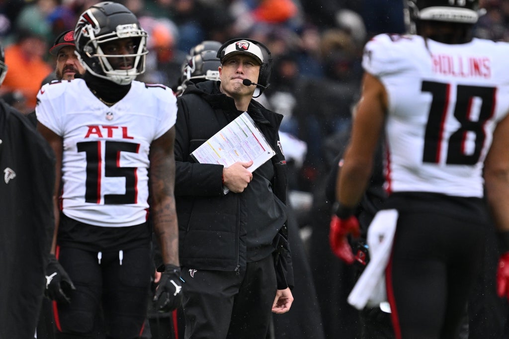 Atlanta Falcons head coach Arthur Smith looks up at the scoreboard during the second half against the Chicago Bears at Soldier Field.
