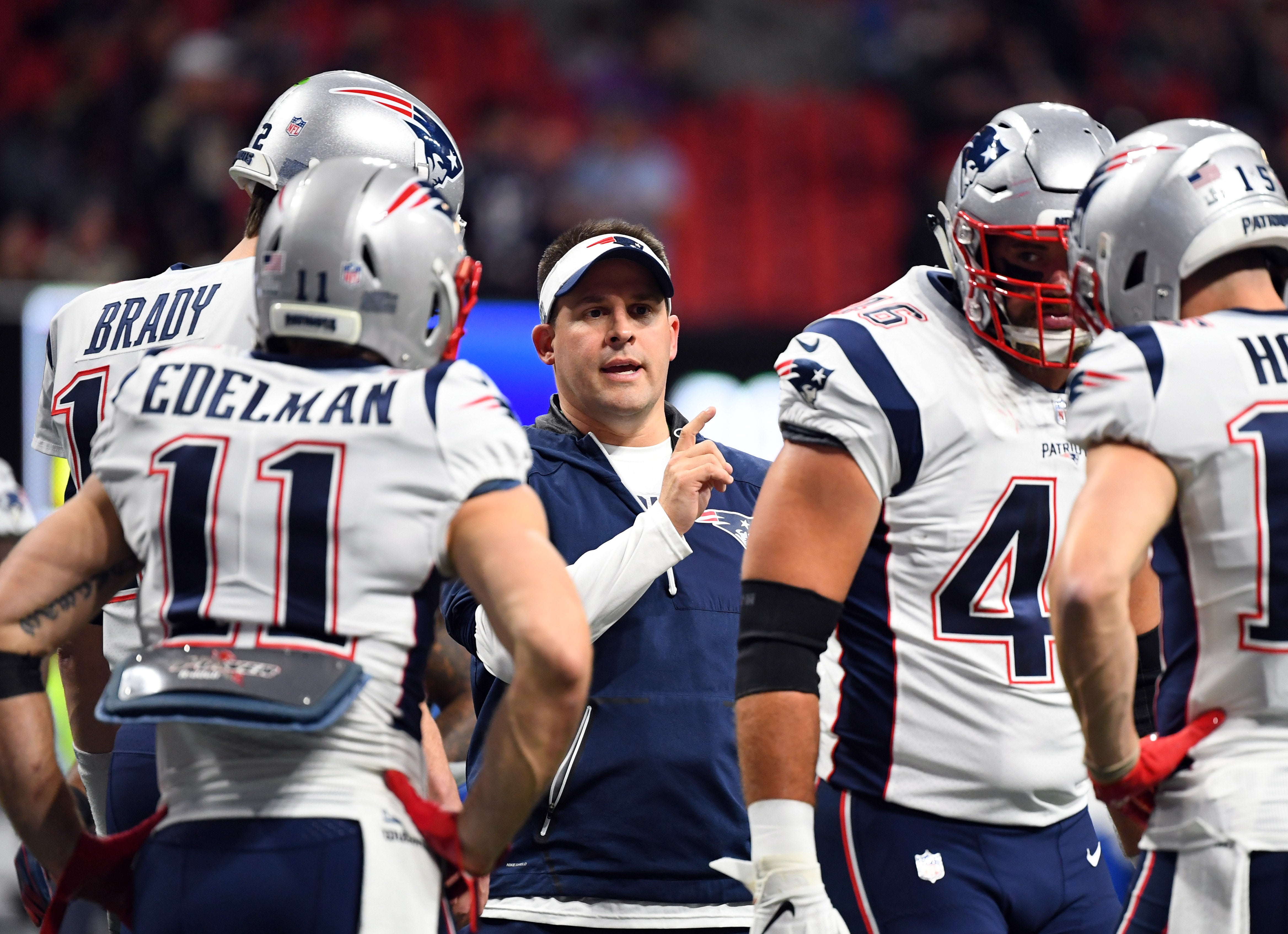 New England Patriots offensive coordinator Josh McDaniels talks to wide receiver Julian Edelman and teammates before Super Bowl LIII against the Los Angeles Rams at Mercedes-Benz Stadium.