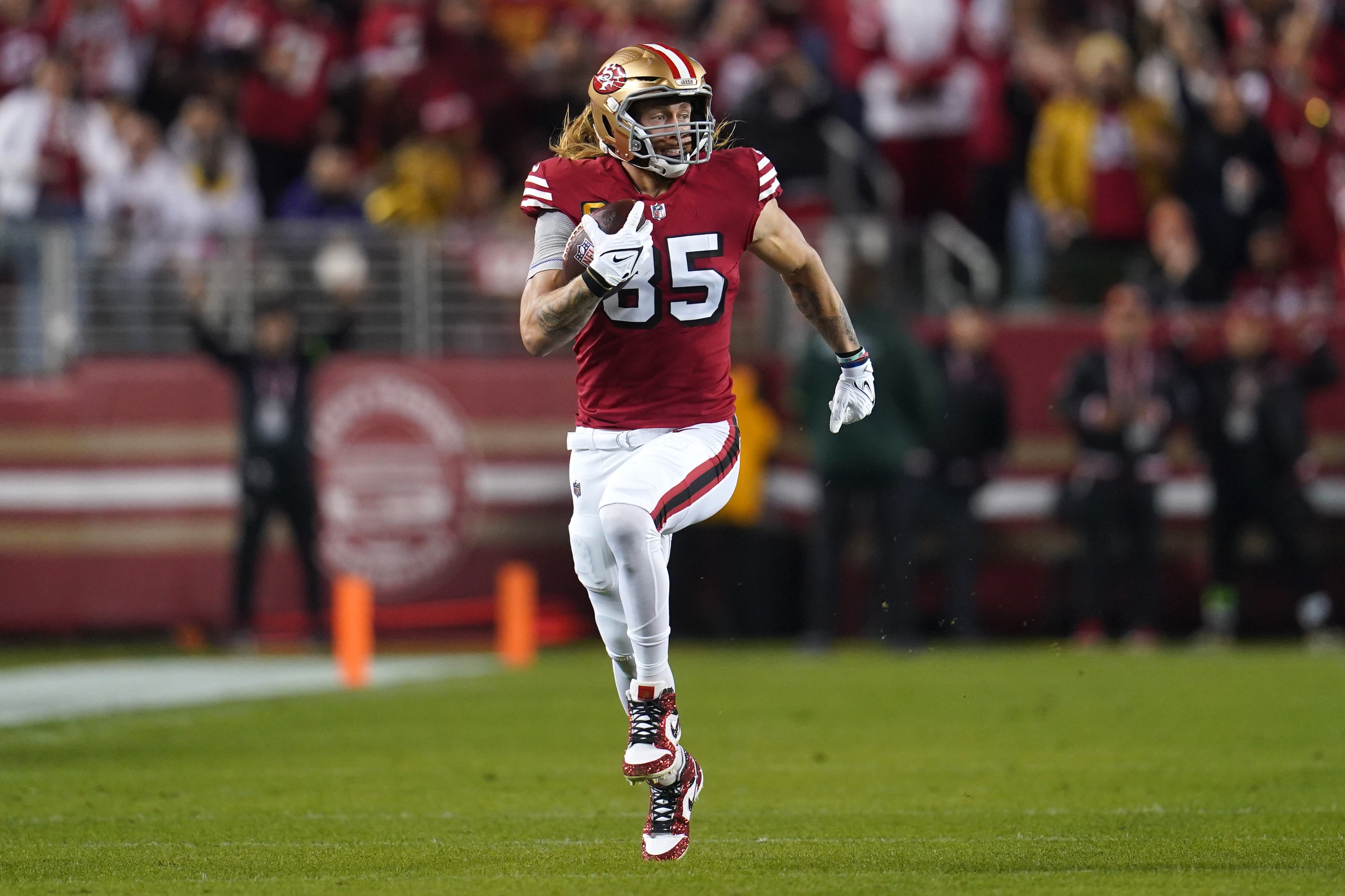 Dec 25, 2023; Santa Clara, California, USA; San Francisco 49ers tight end George Kittle (85) runs with the ball after making a catch for a first down against the Baltimore Ravens in the first quarter at Levi's Stadium.