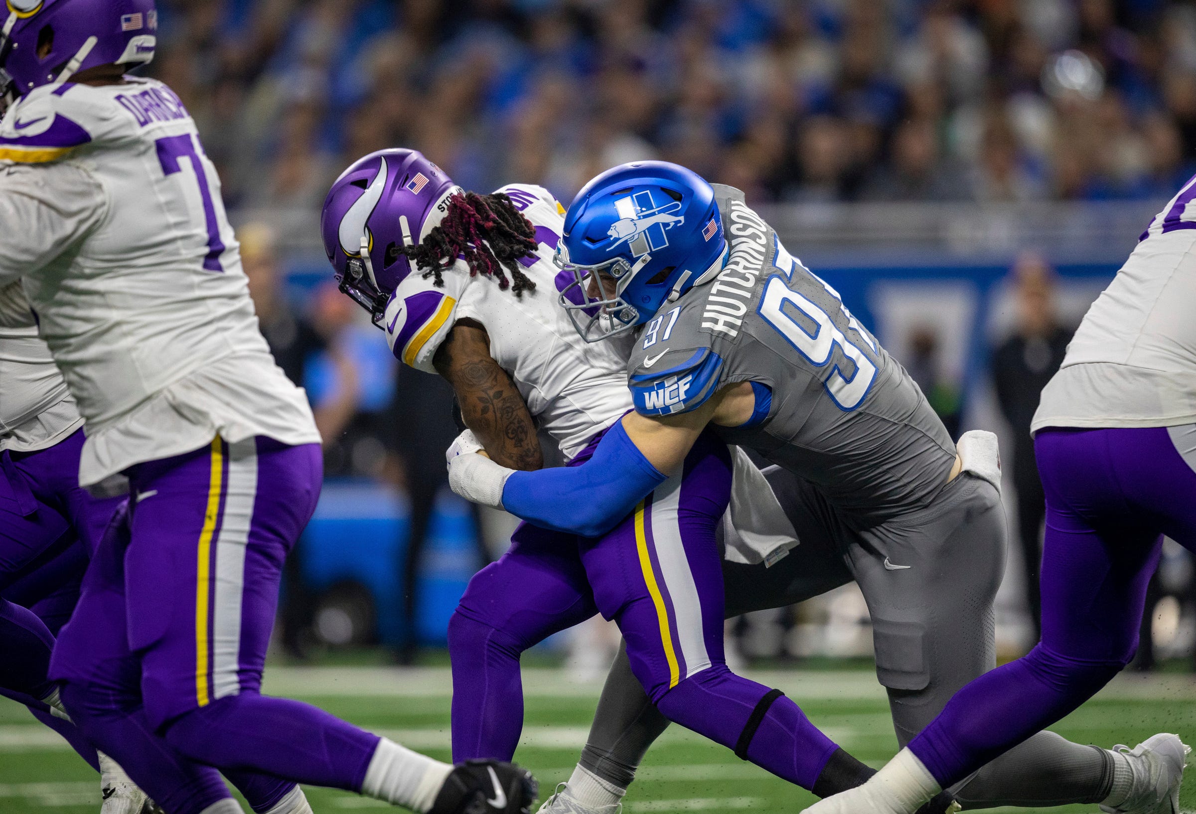 Detroit Lions defensive end Aidan Hutchinson tackles Minnesota Vikings running back Alexander Mattison at Ford Field in Detroit on Sunday, Jan. 7, 2024.