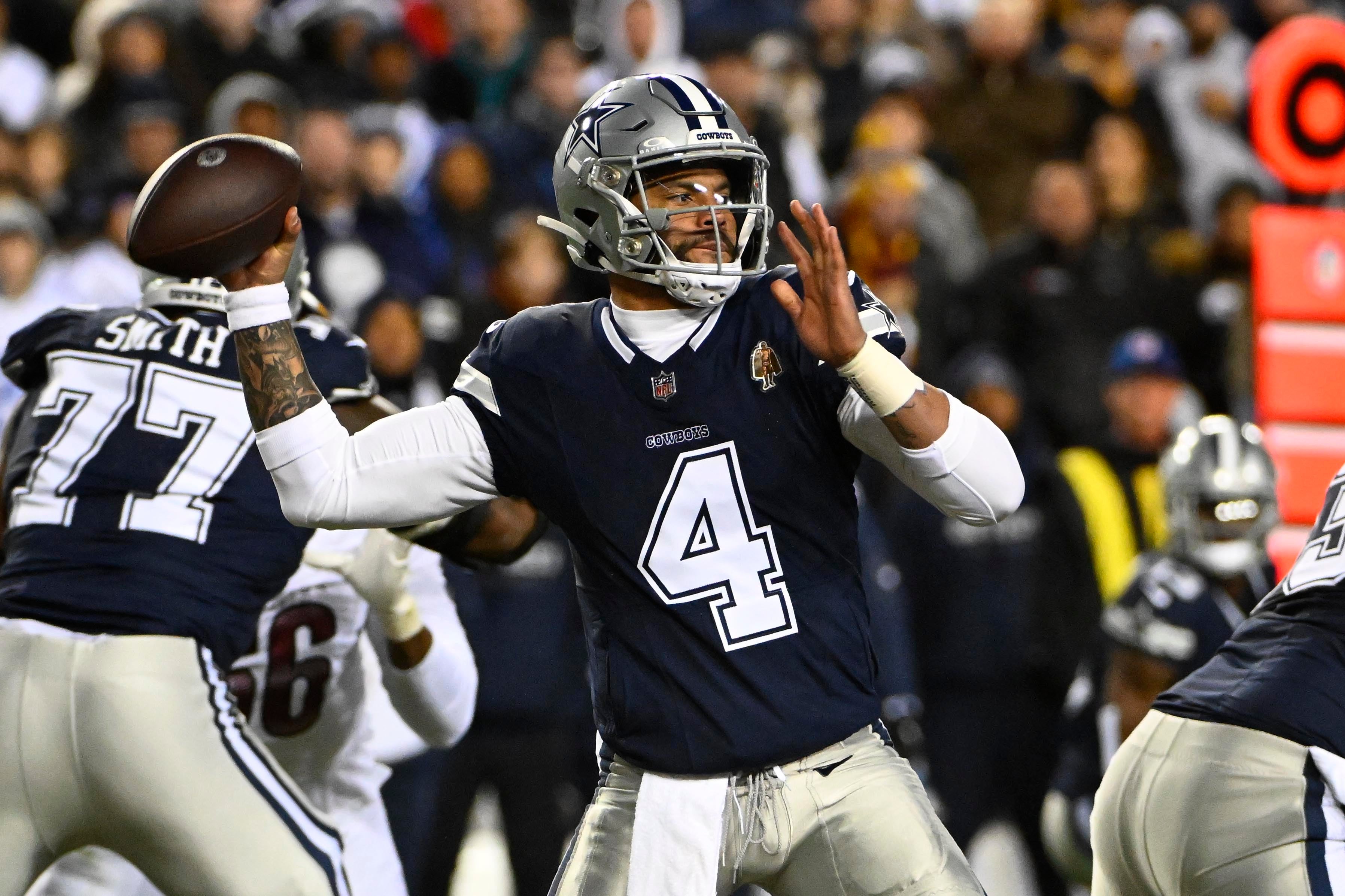 Dallas Cowboys quarterback Dak Prescott (4) attempts a pass against the Washington Commanders during the first half at FedExField.