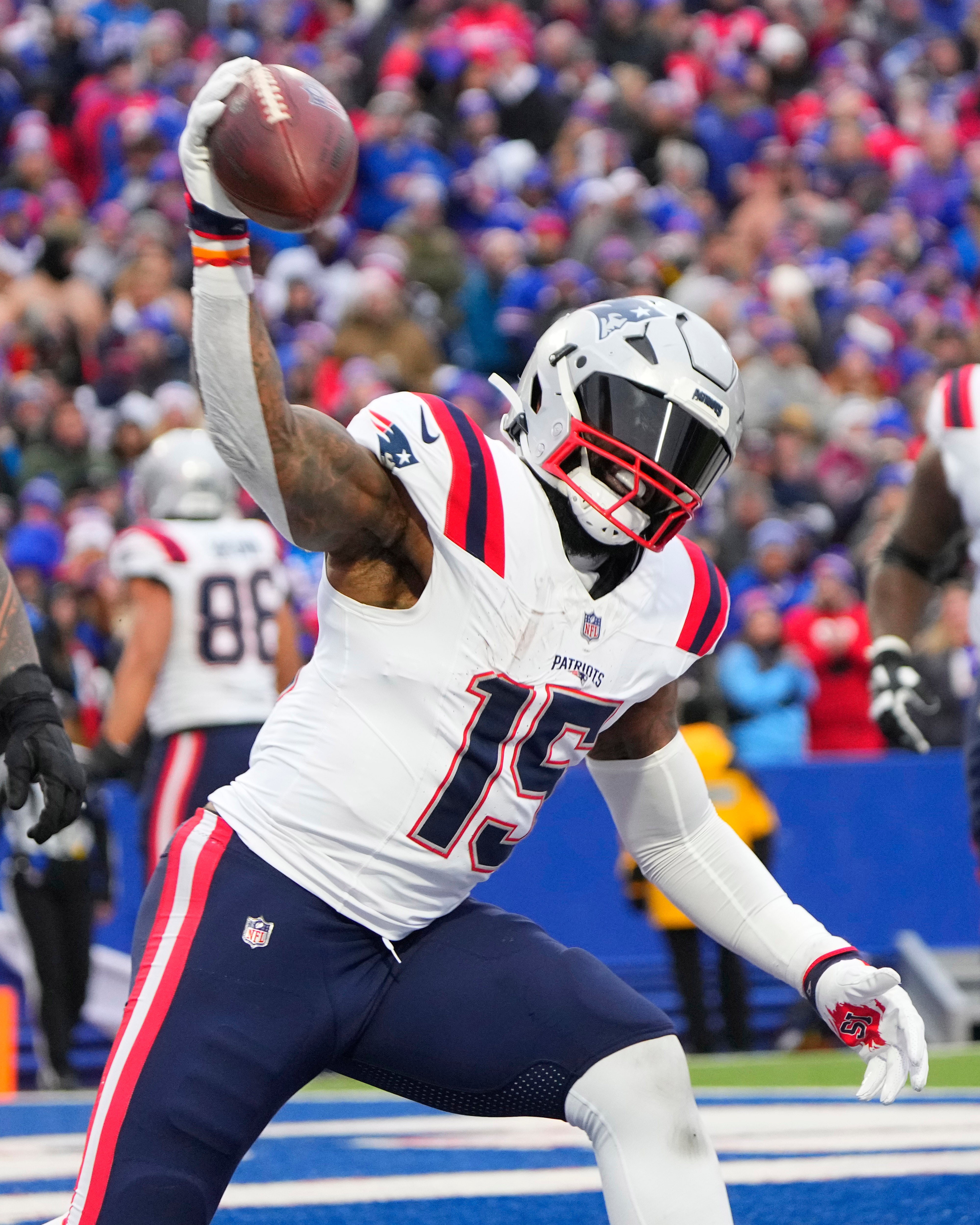 New England Patriots running back Ezekiel Elliott spikes the ball after scoring a touchdown against the Buffalo Bills during the second half at Highmark Stadium