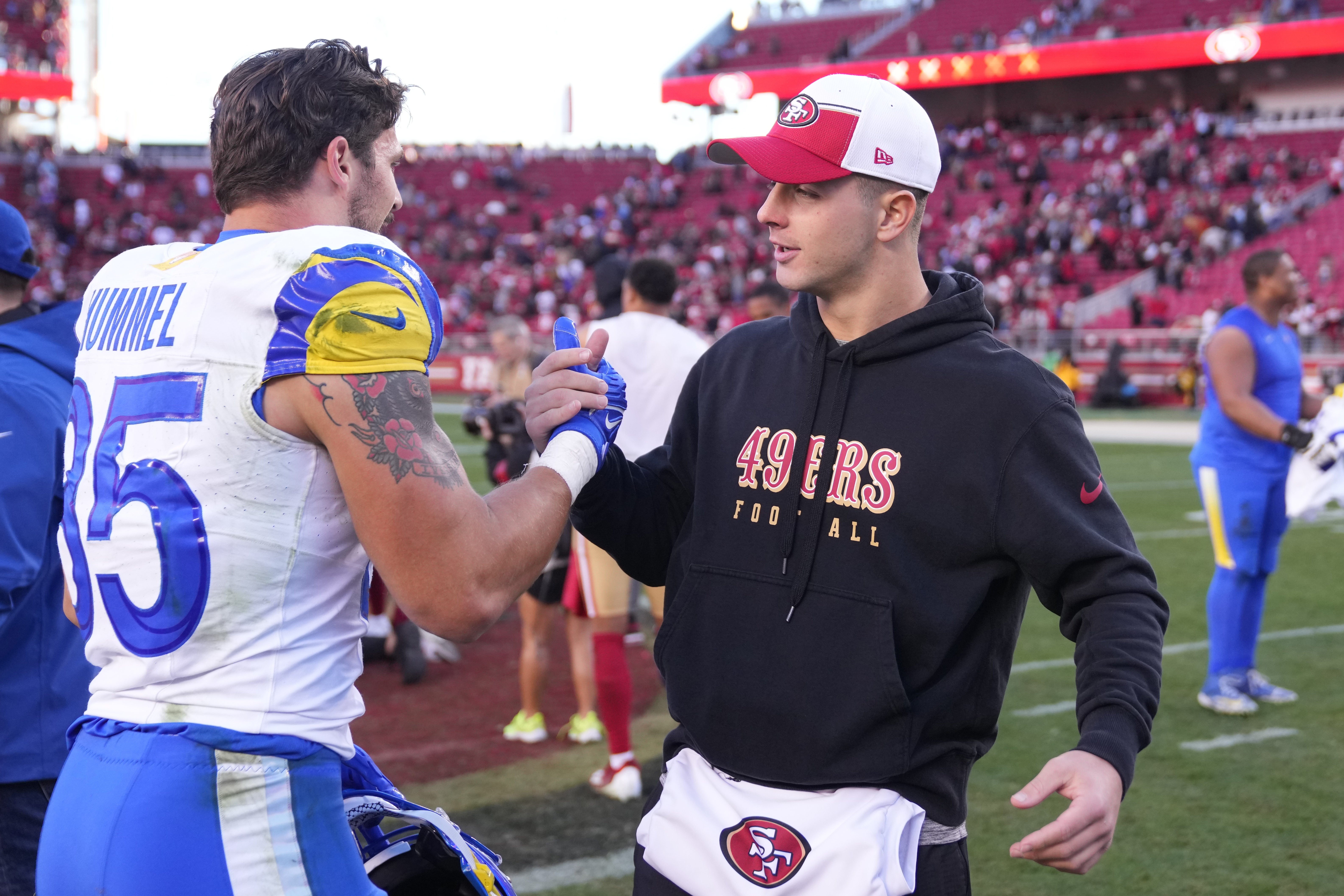 Jan 7, 2024; Santa Clara, California, USA; Los Angeles Rams linebacker Jake Hummel (35) and San Francisco 49ers quarterback Brock Purdy (right) shake hands after the game at Levi's Stadium.
