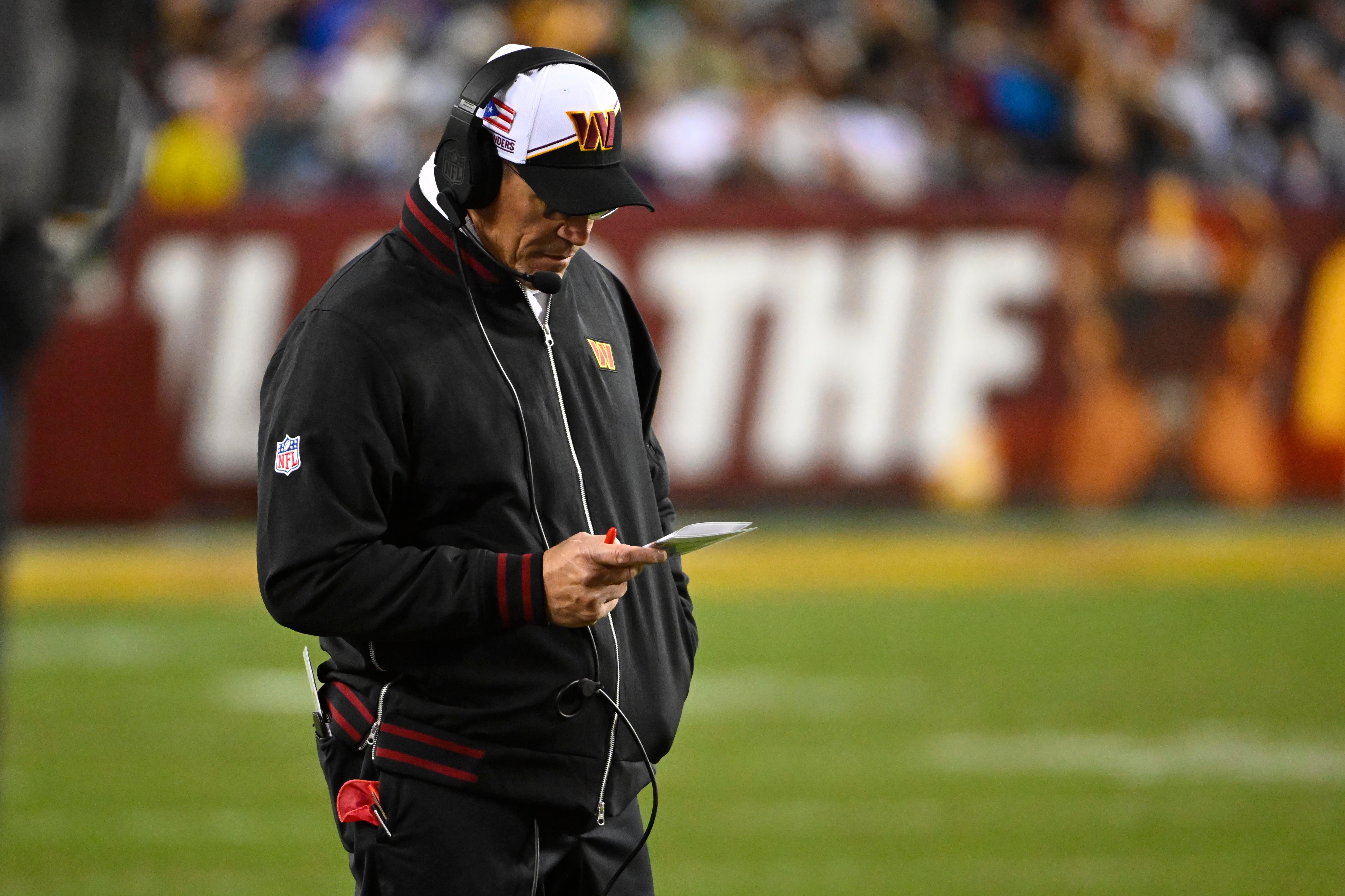 Washington Commanders head coach Ron Rivera looks on against the Dallas Cowboys during the first half at FedExField.