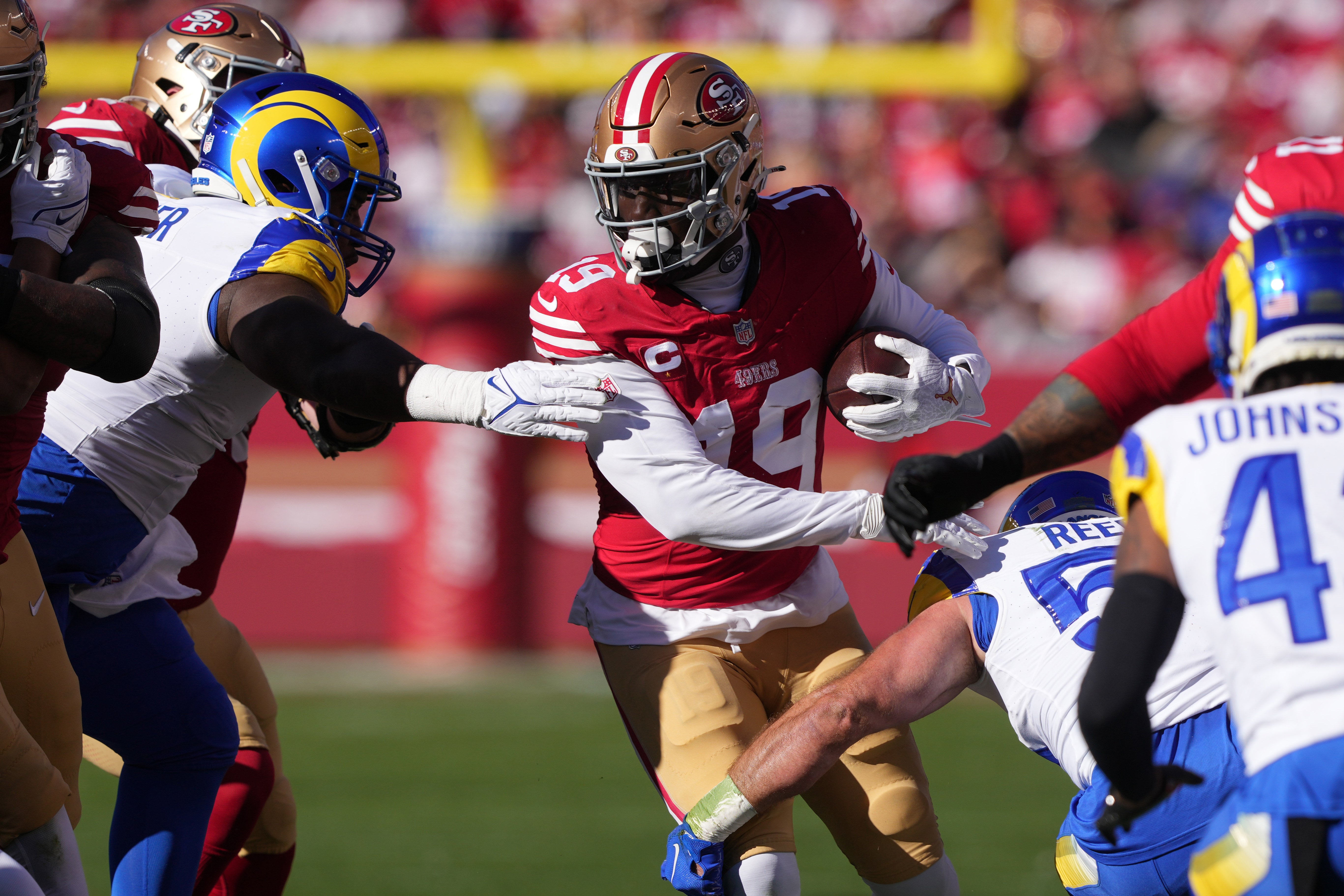 Jan 7, 2024; Santa Clara, California, USA; San Francisco 49ers wide receiver Deebo Samuel (19) carries the ball against the Los Angeles Rams during the first quarter at Levi's Stadium.