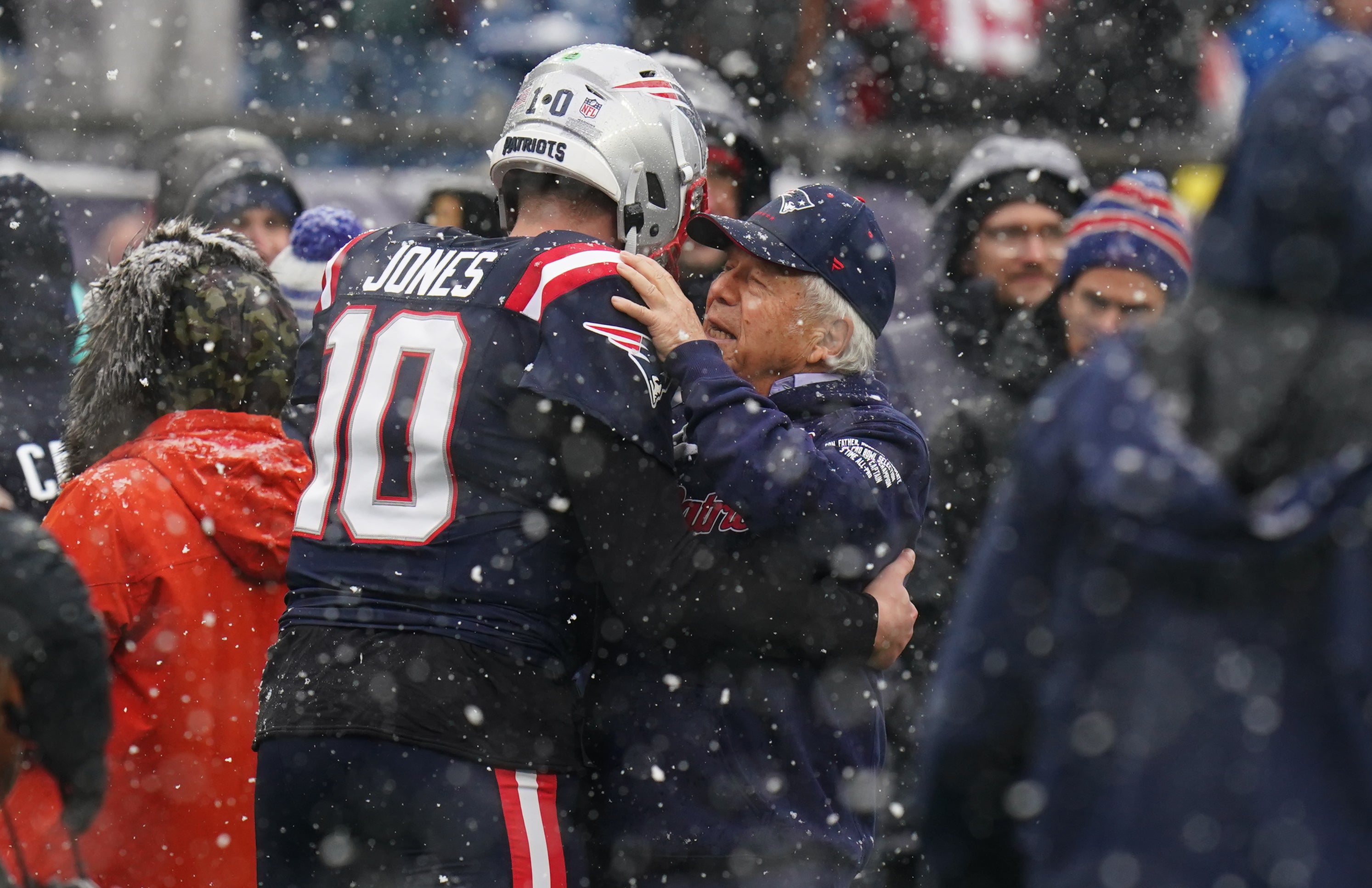 New England Patriots owner Robert Kraft greets quarterback Mac Jones after warm up before the start of the game against the New York Jets at Gillette Stadium.