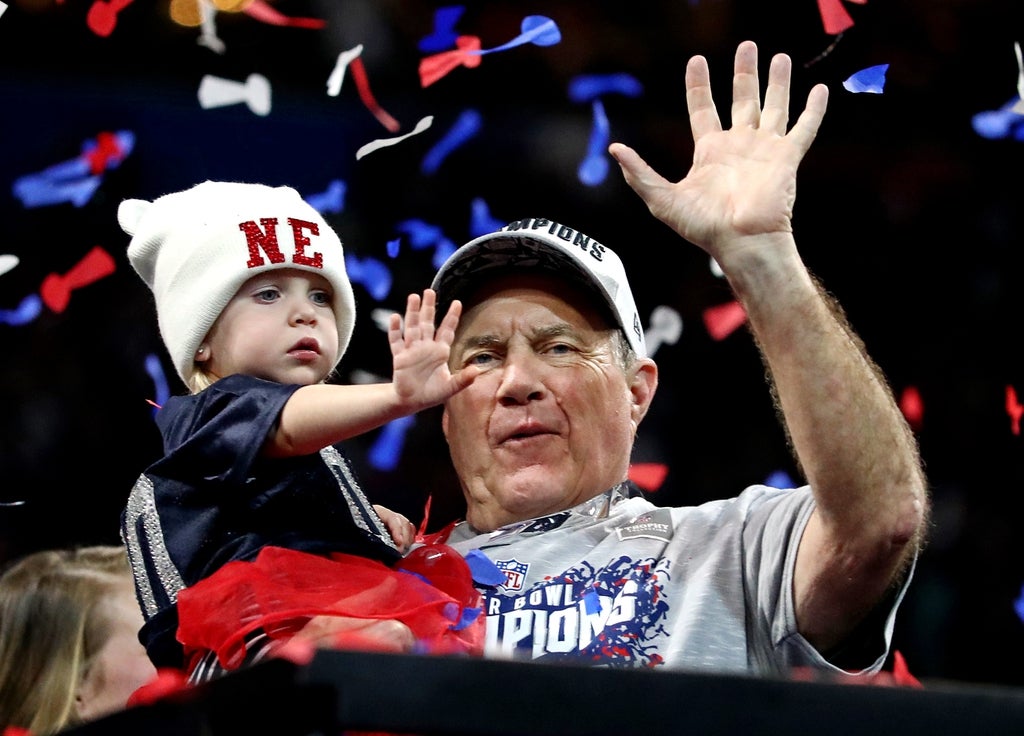 New England Patriots head coach Bill Belichick celebrates with granddaughter Blakely after beating the Los Angeles Rams in Super Bowl LIII at Mercedes-Benz Stadium.