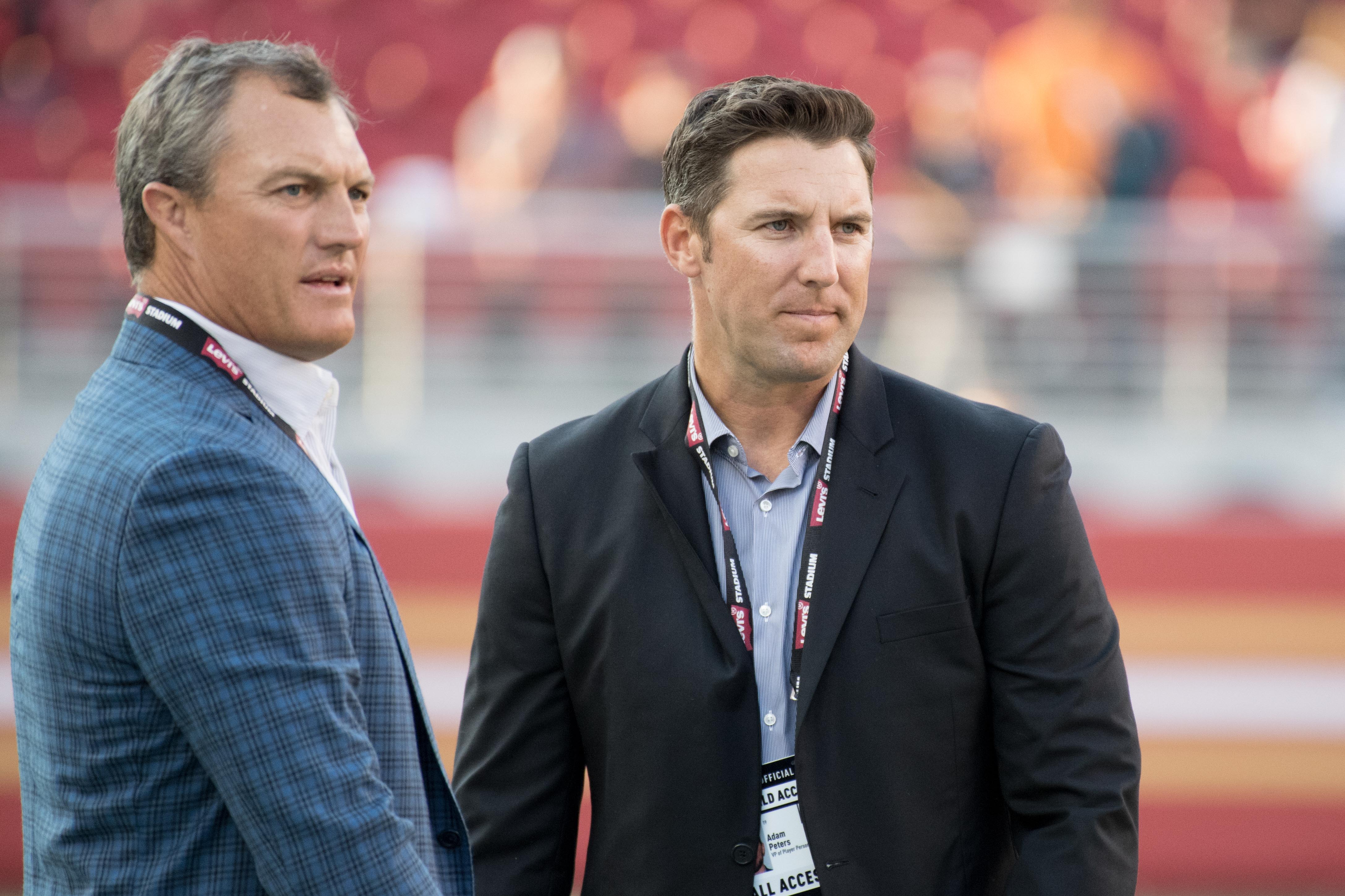 NFL: Denver Broncos at San Francisco 49ers Caption: August 19, 2017; Santa Clara, CA, USA; San Francisco 49ers general manager John Lynch (left) and vice president of player personnel Adam Peters (right) before the game against the Denver Broncos at Levi's Stadium.
