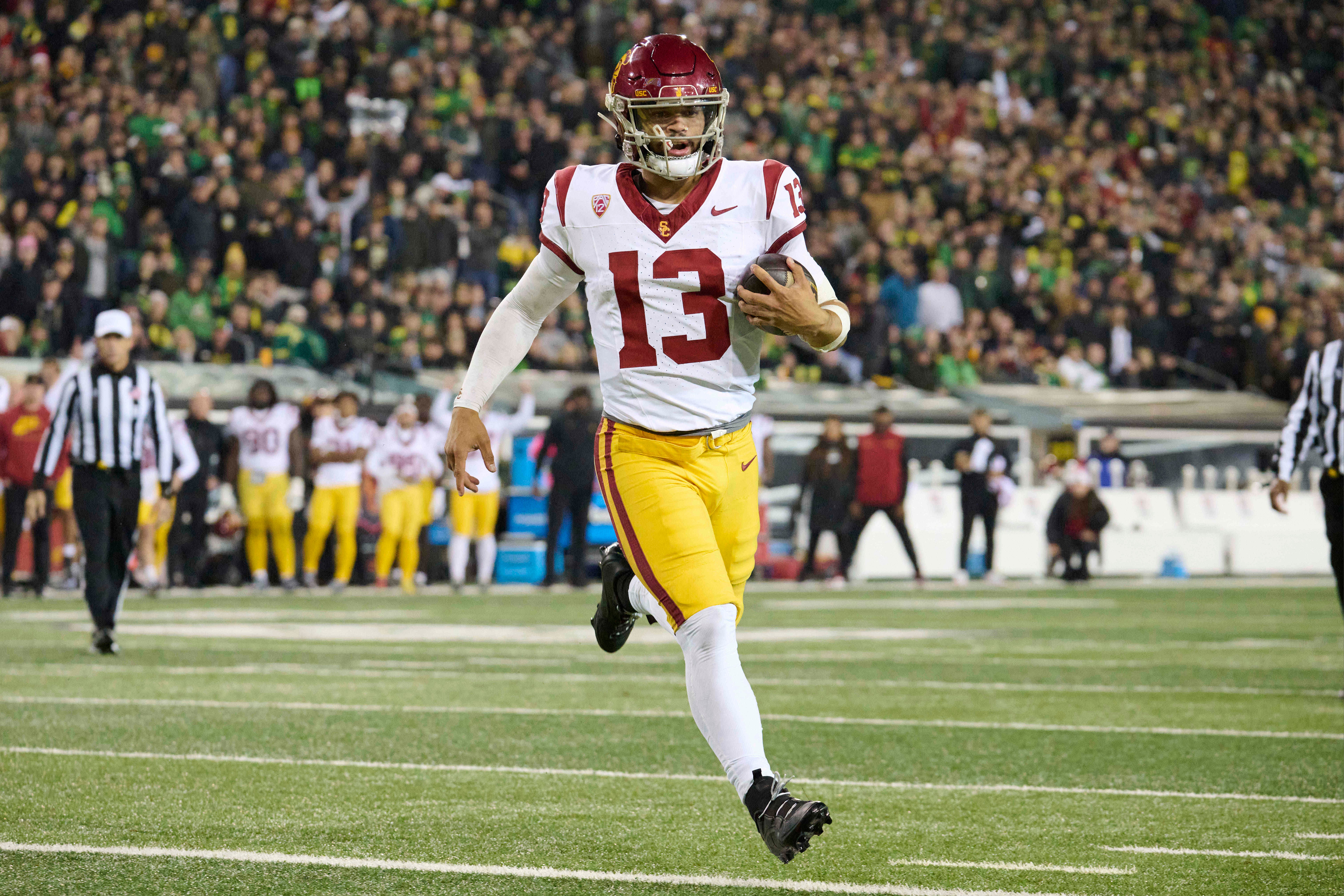 Nov 11, 2023; Eugene, Oregon, USA; USC Trojans quarterback Caleb Williams (13) scores a touchdown during the first half against the Oregon Ducks at Autzen Stadium.